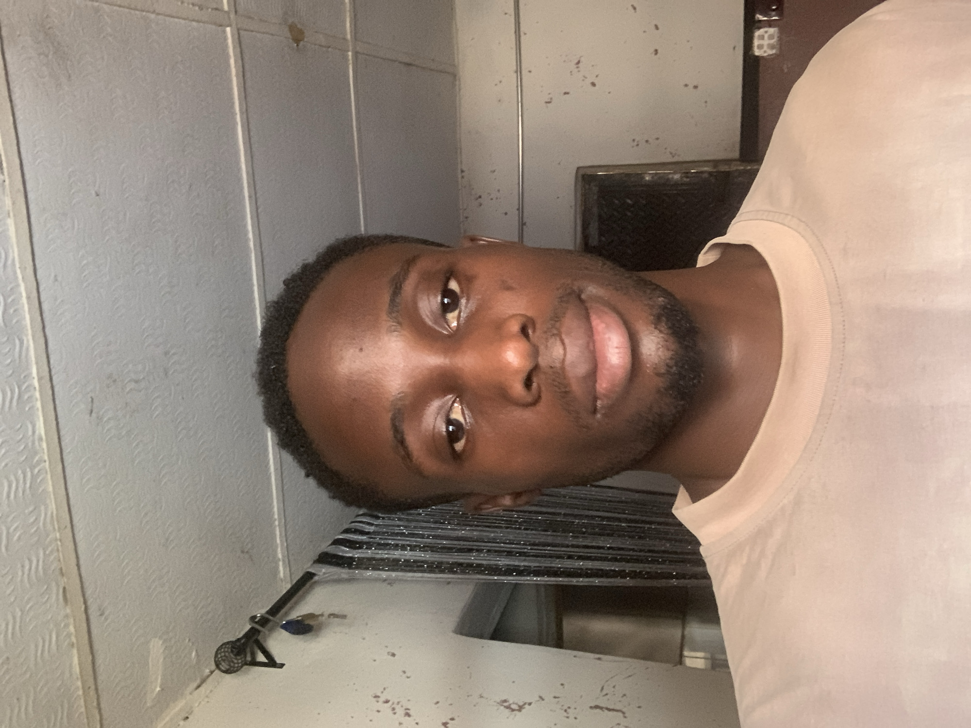 Young man documents afternoon through selfies in Lokoja home