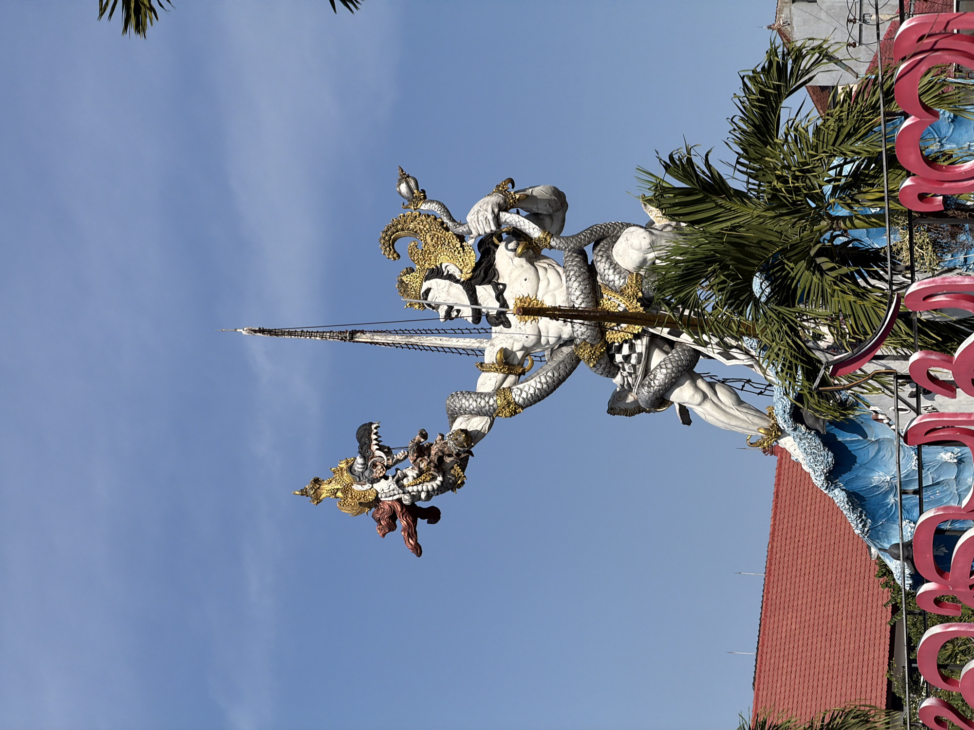 Two angles on Bali's iconic GWK statue at dawn