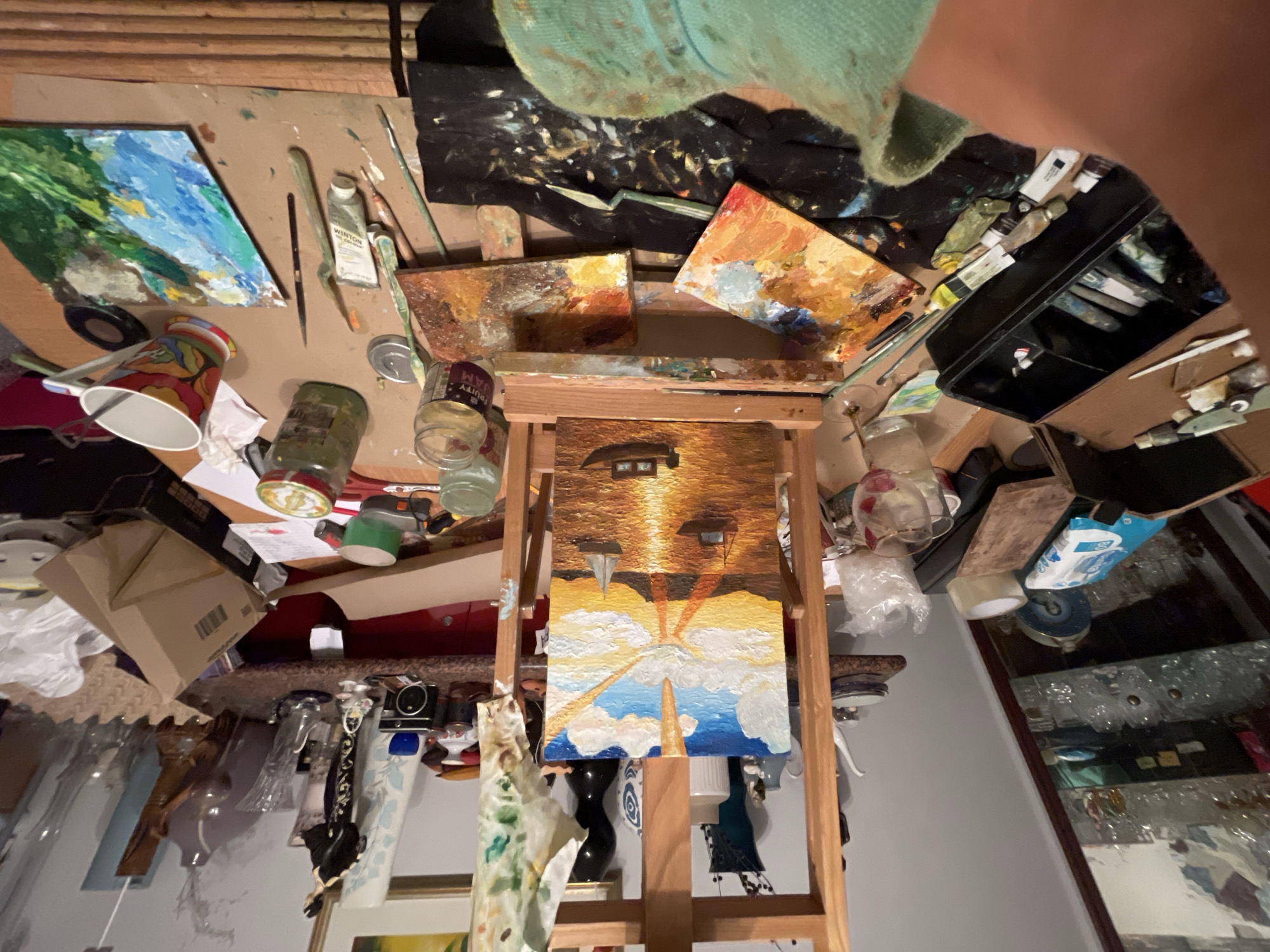 Artist's studio workspace documented in Maidstone with landscape painting