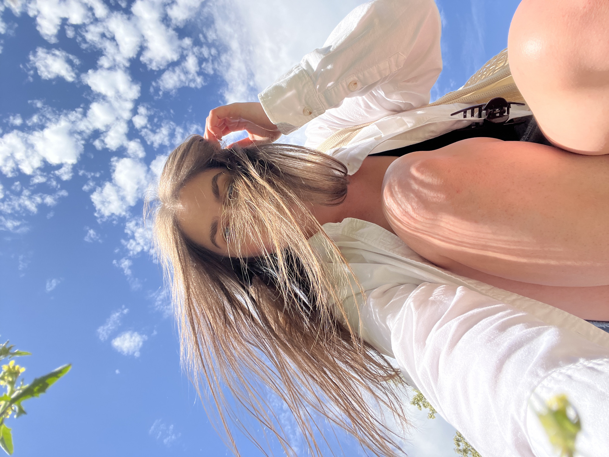 Woman photographed against cloudy sky in Ternopil, Ukraine