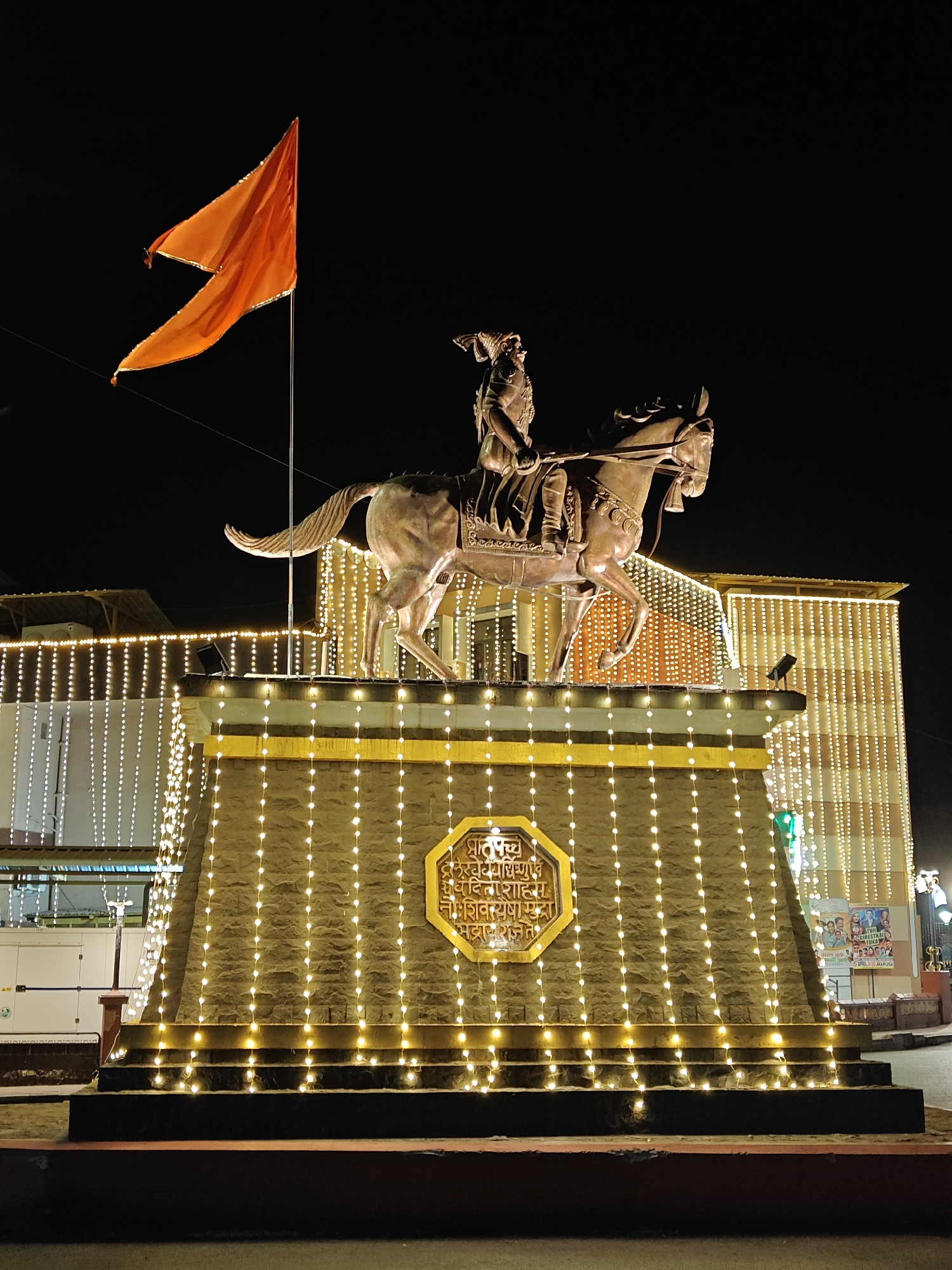 Illuminated monuments and temples captured at night in Mapusa