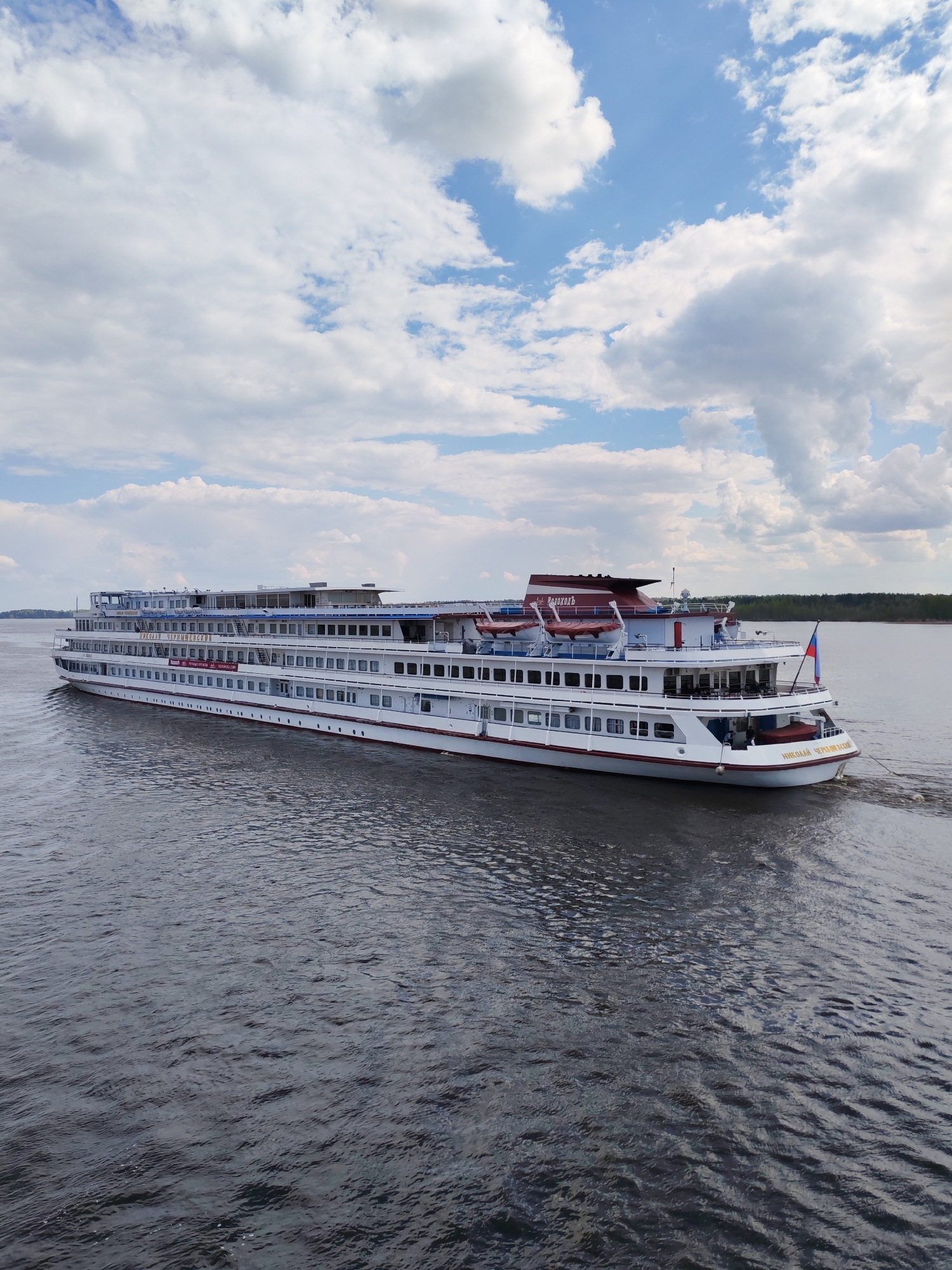 River traffic observed near Pruzhinino includes cruise ships, cargo barge