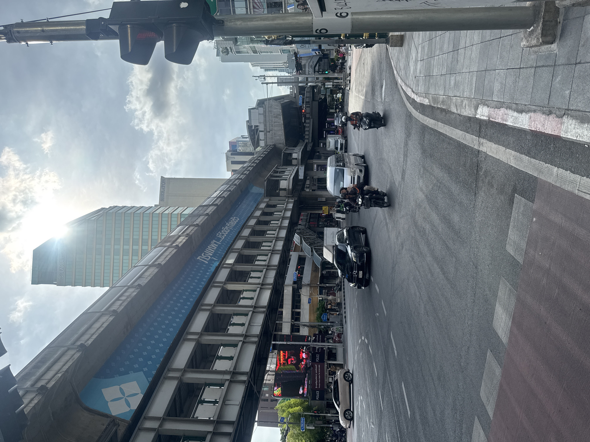 Bangkok street scene captures BTS Skytrain and urban infrastructure