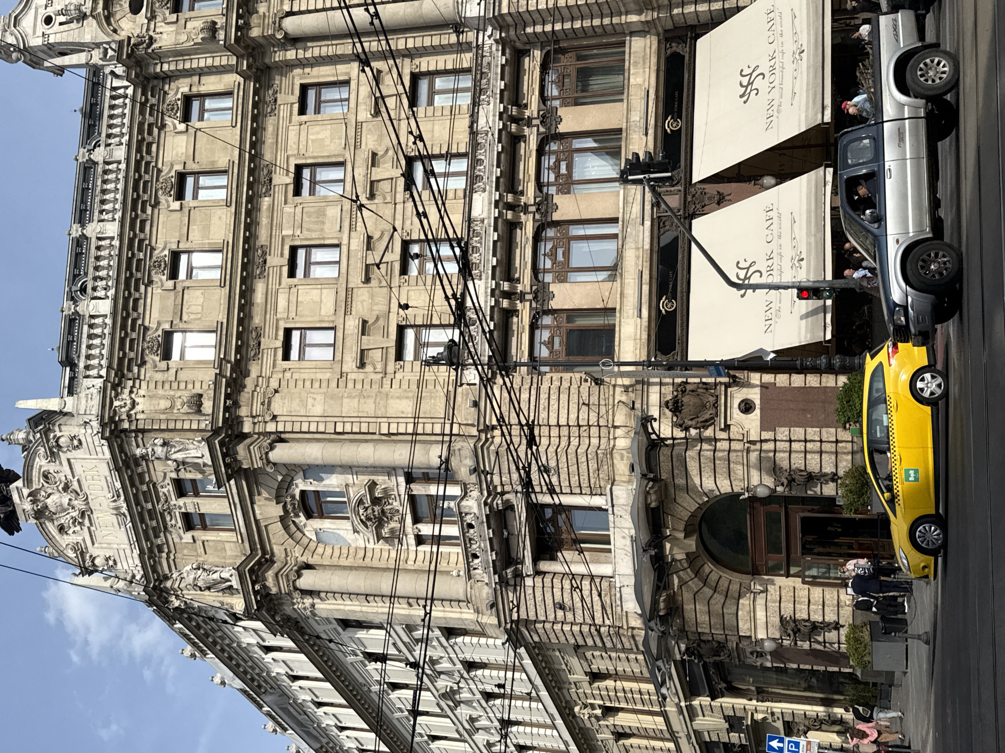 Silver truck parked outside historic New York Café Budapest