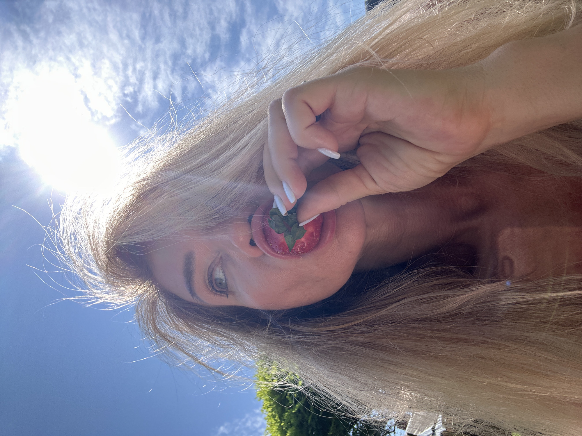 Woman enjoys sunny morning backyard time in Armavir