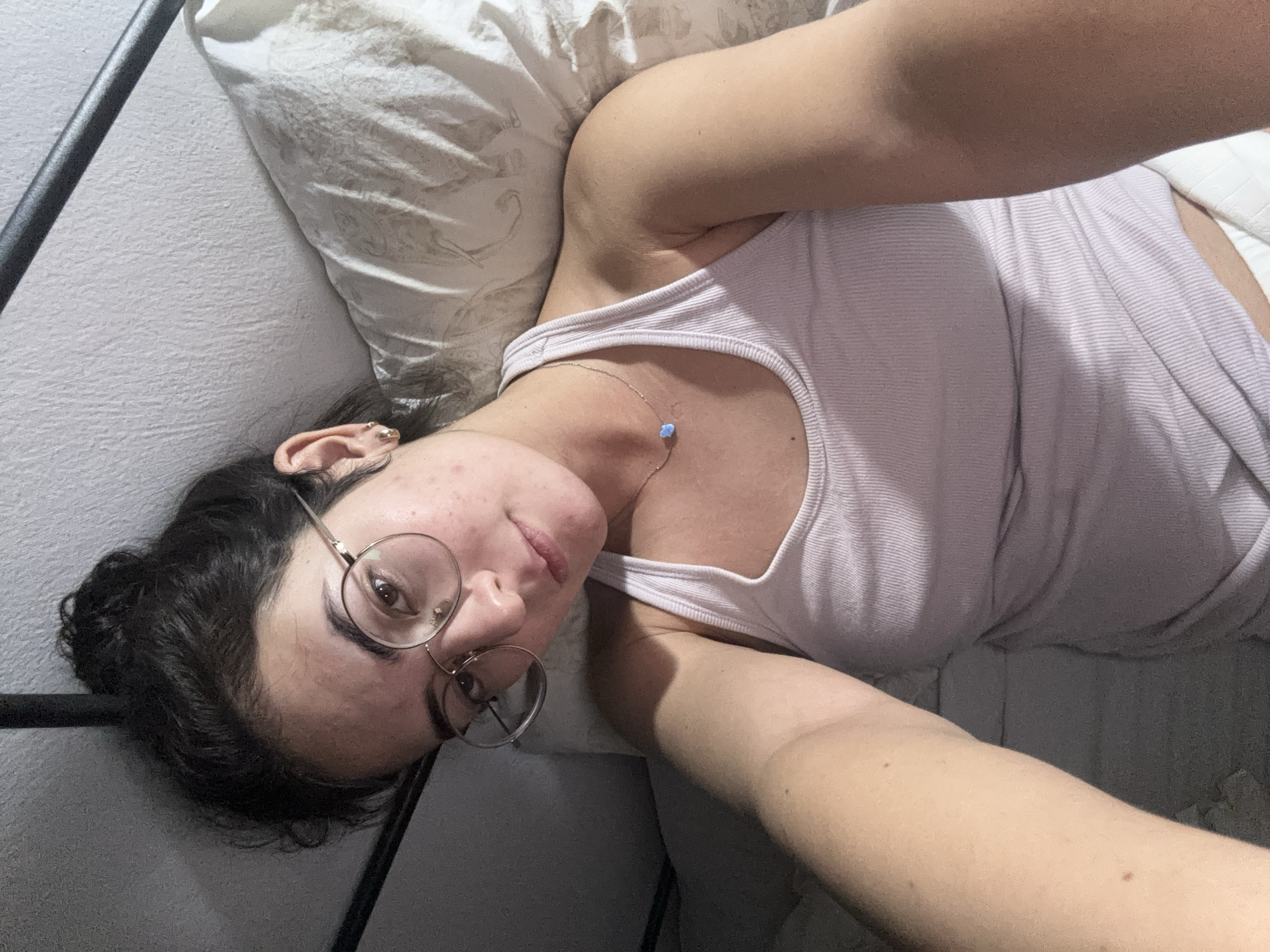 Woman rests in bed during early morning hours in Puebla