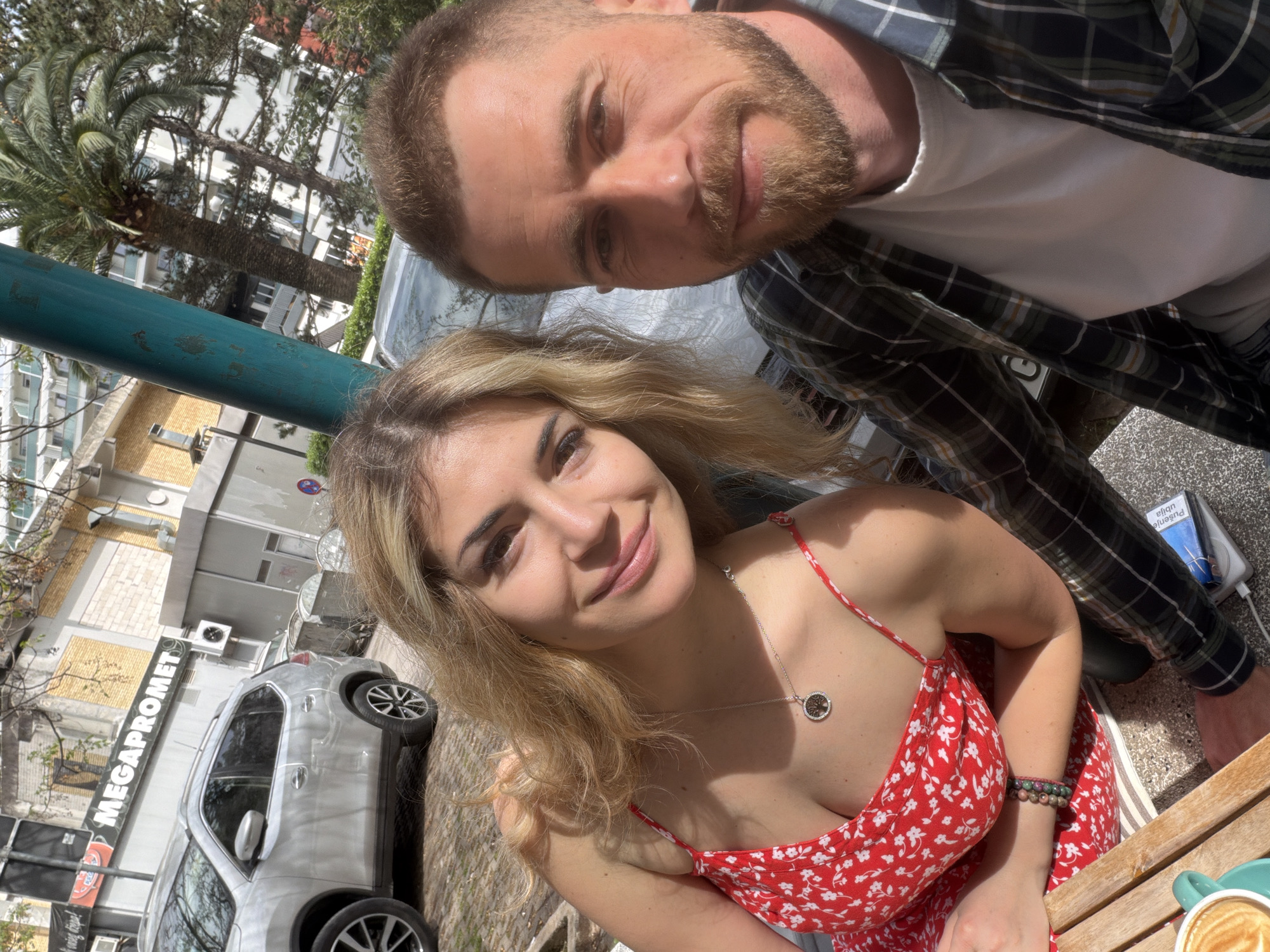 Couple photographed at outdoor cafe in Budva, Montenegro