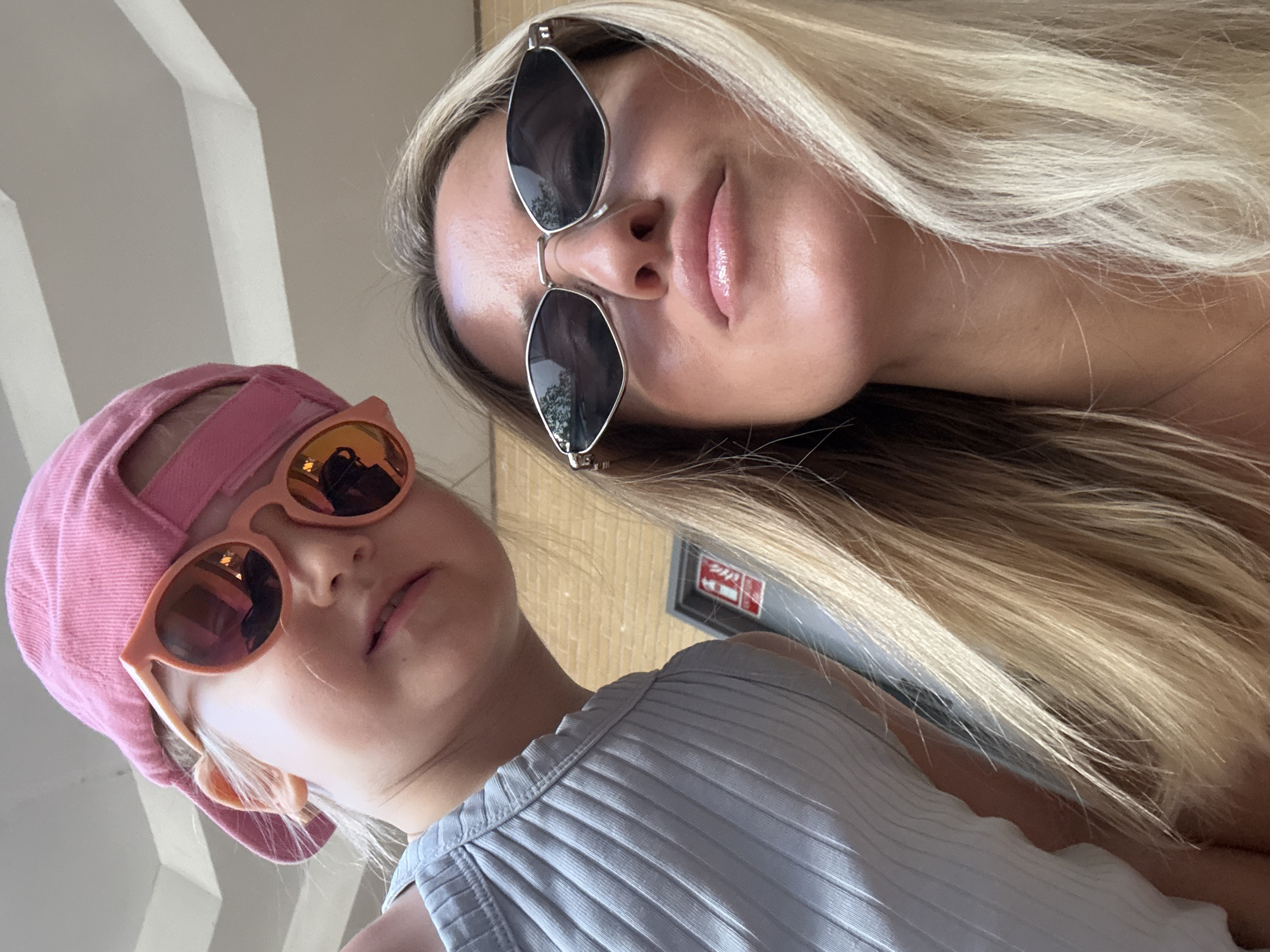 Selfies and shopping in a shaded Valencia walkway