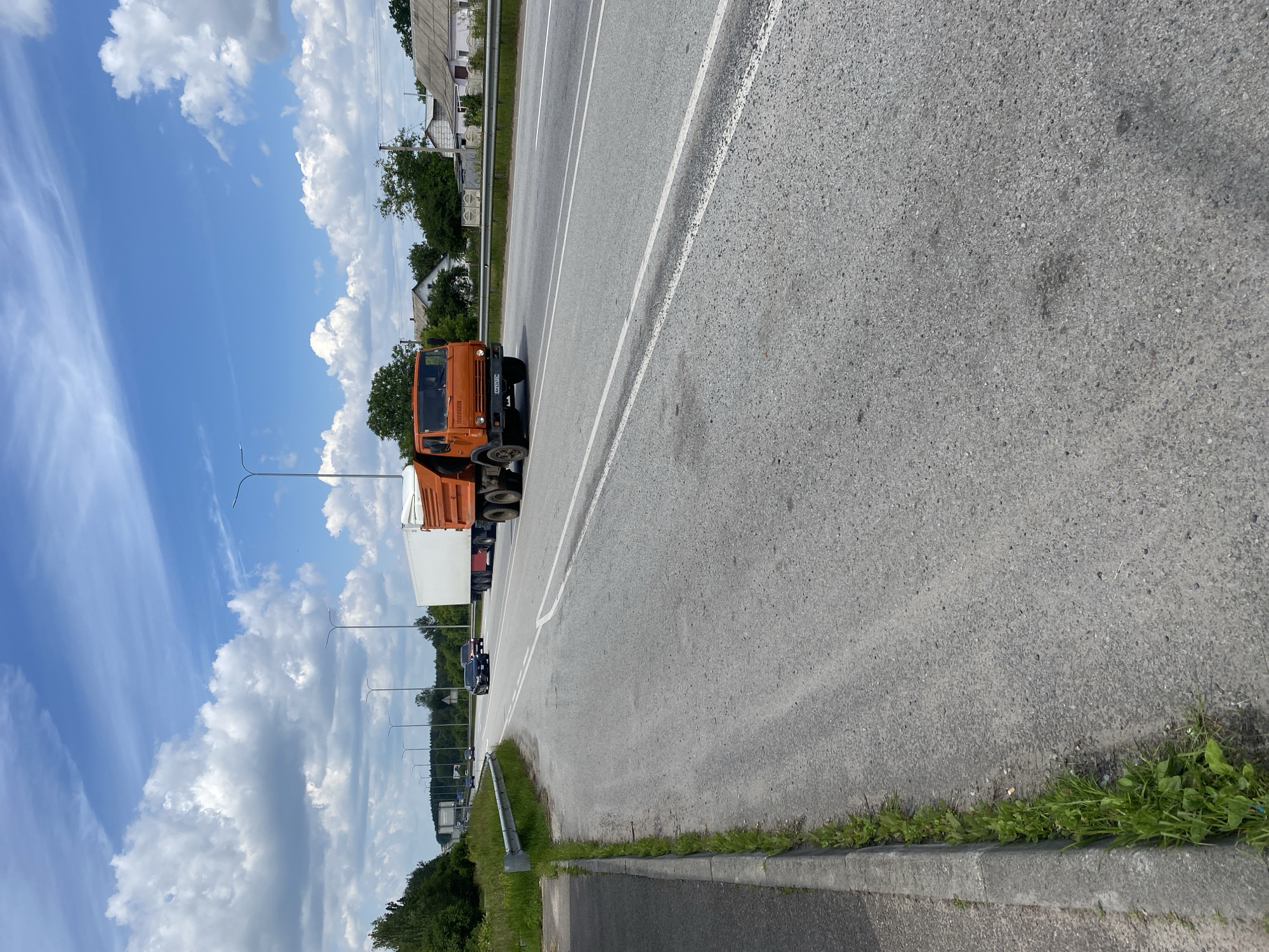 Heavy truck traffic moves through a Ukrainian highway corridor