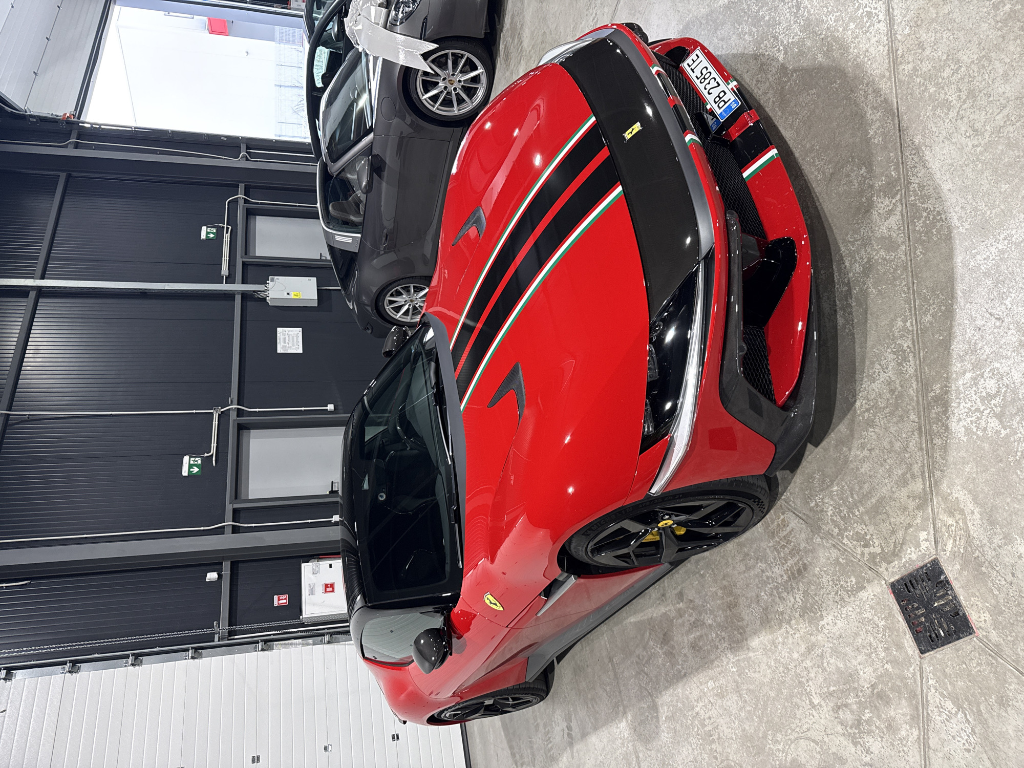 Striped red Ferrari parked in a Plovdiv garage