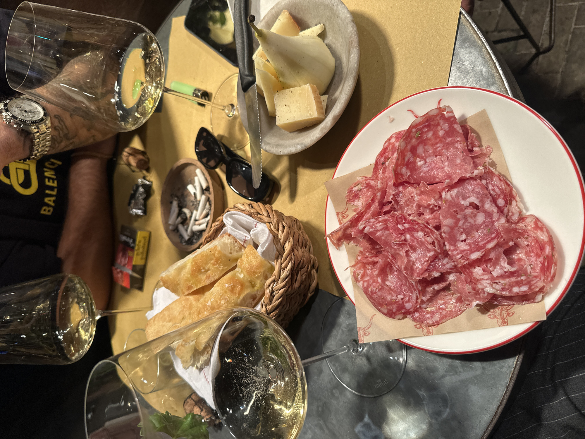 Evening dining scene captured in London with wine glasses