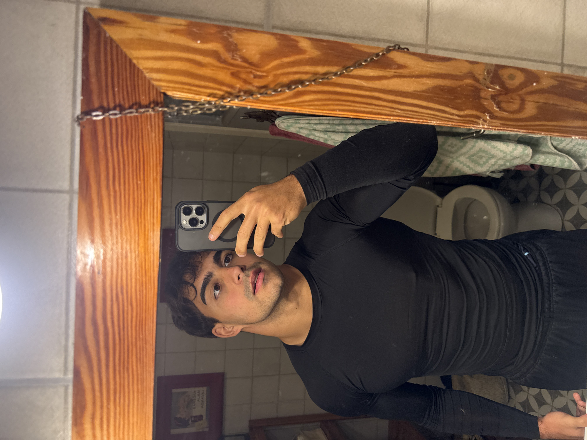 Man takes playful bathroom selfies in Avellaneda, Argentina