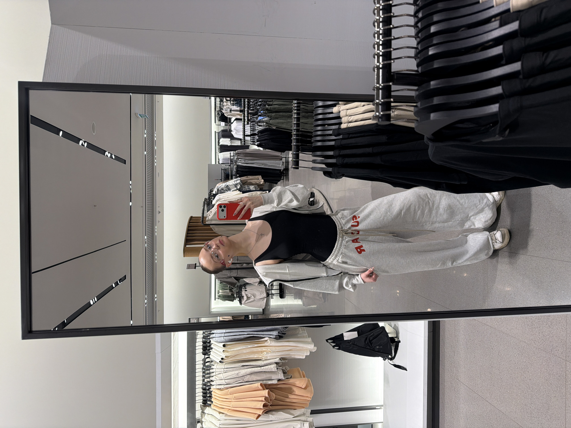 Person Takes Mirror Selfie in Khimki Clothing Store