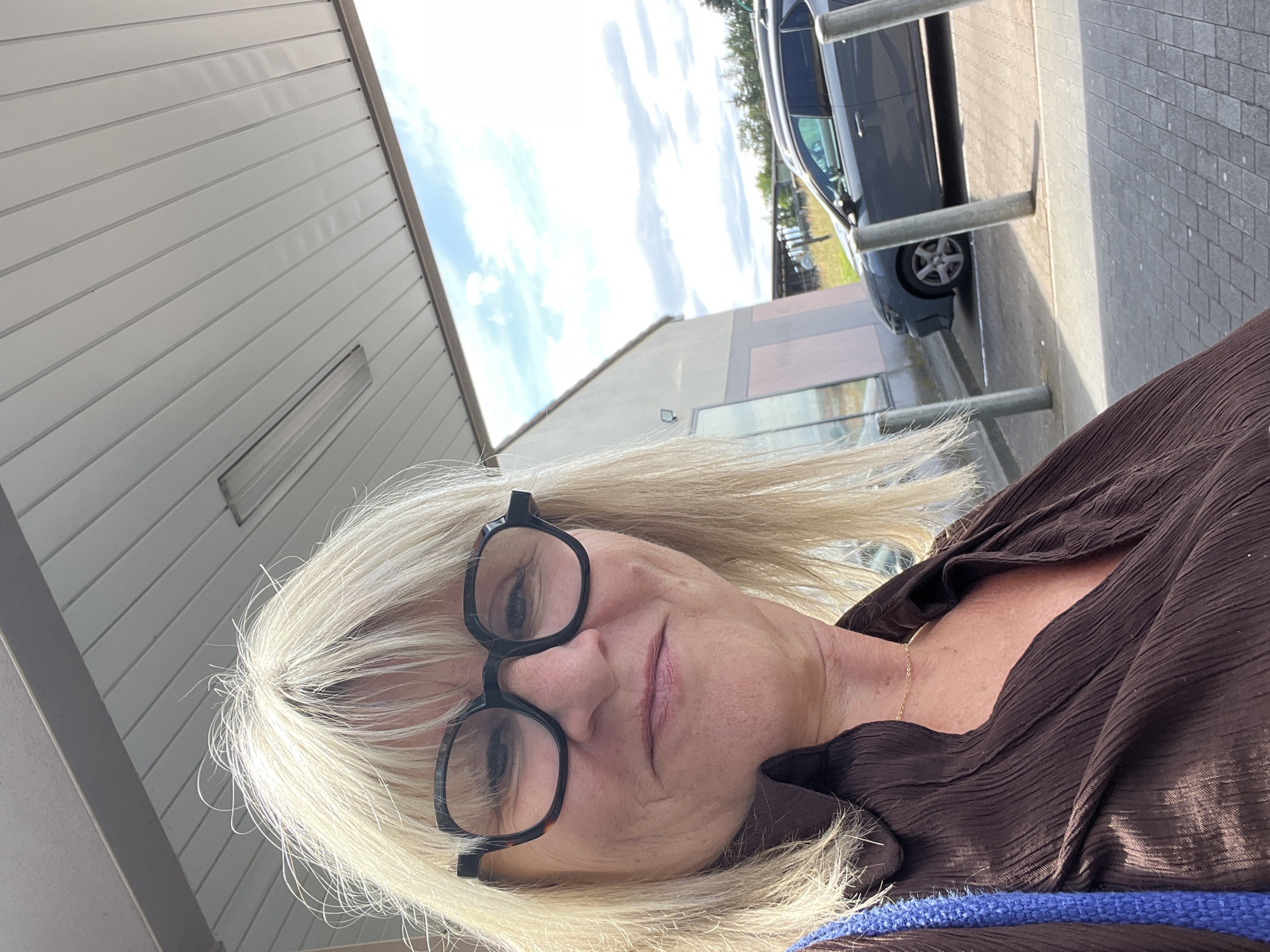 Woman takes selfie in Saint-Galmier, France