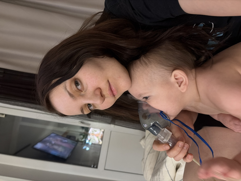 Russian mother tends baby, plays with cat during quiet morning