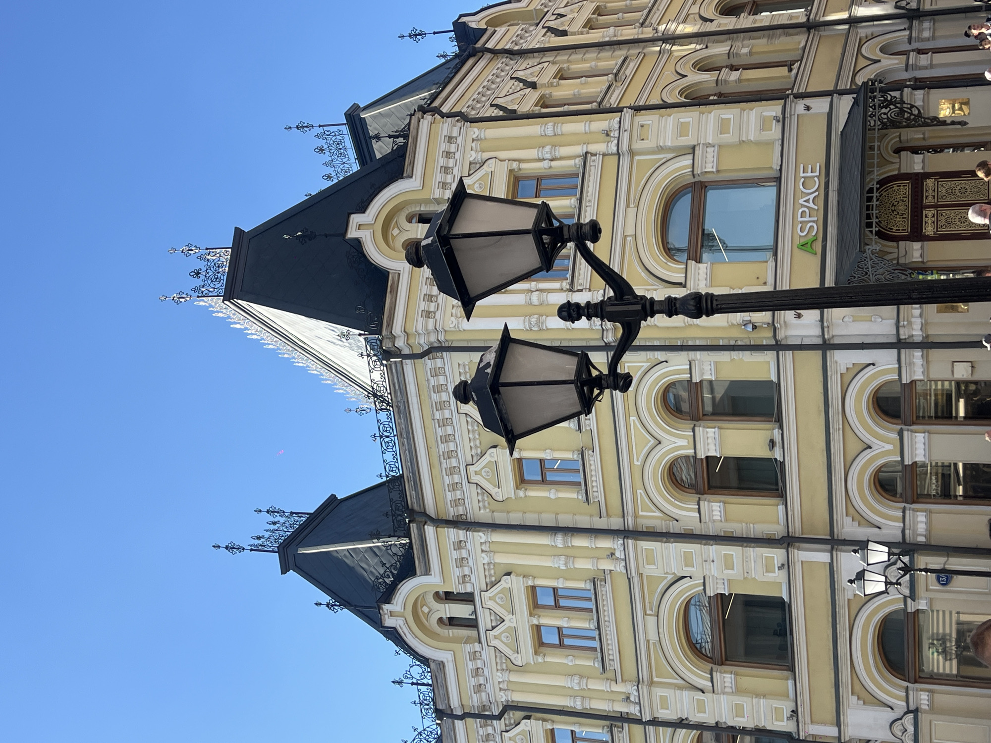 Tourist documents sunny afternoon stroll through historic Moscow streets