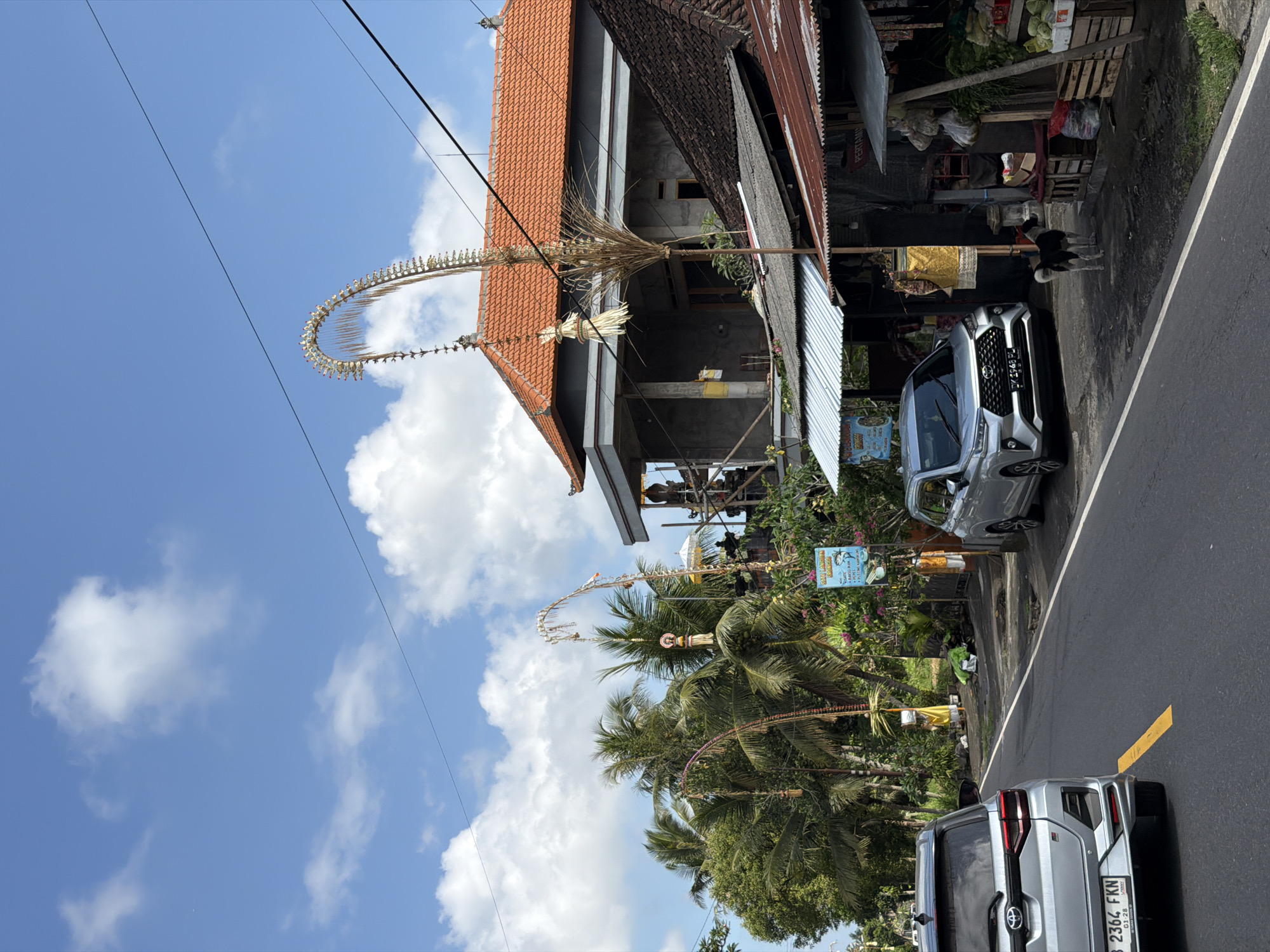 Street life and temple architecture along a Tampaksiring road