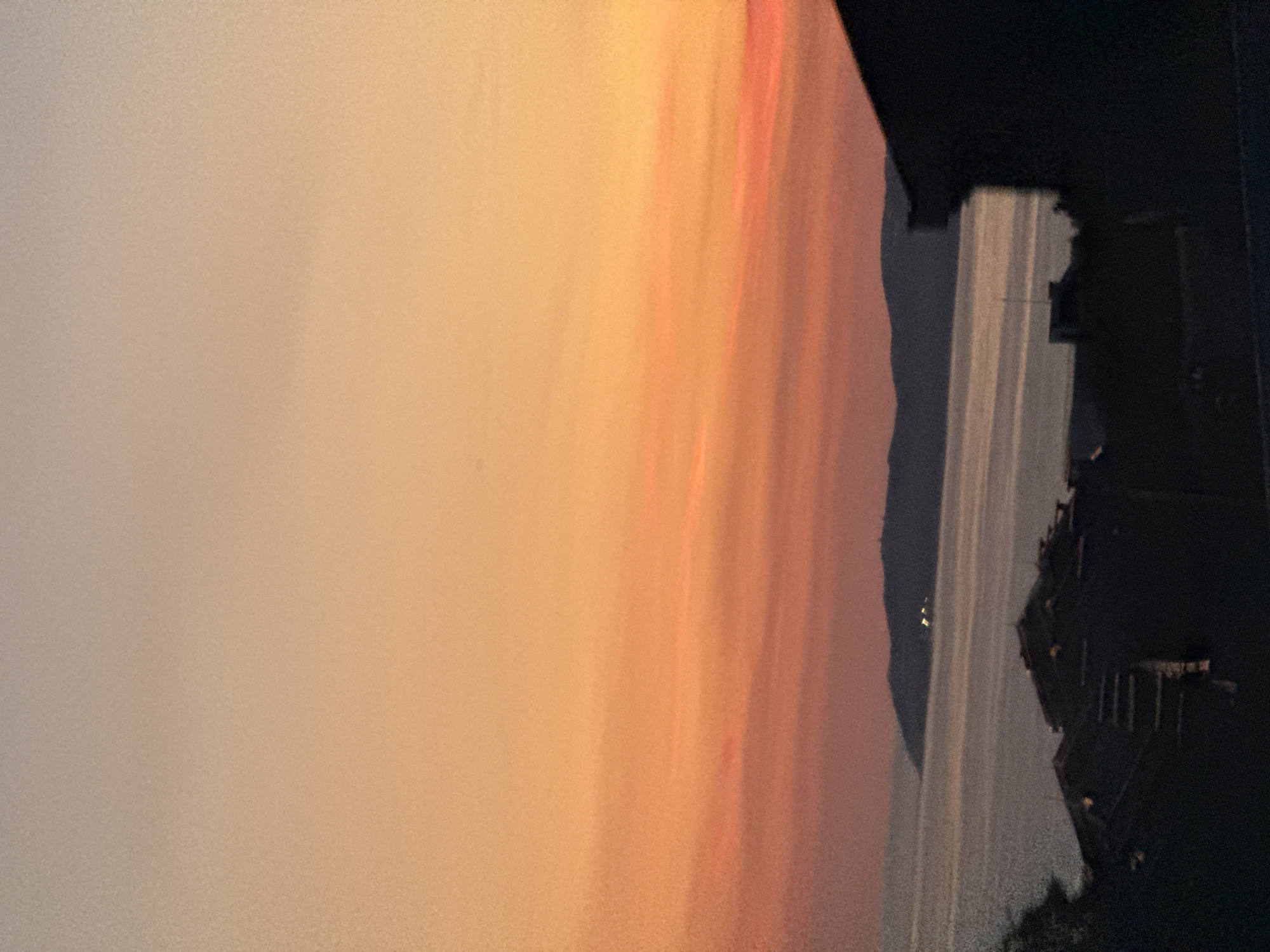 Coastal evening drive, street scenes, and a cat at home