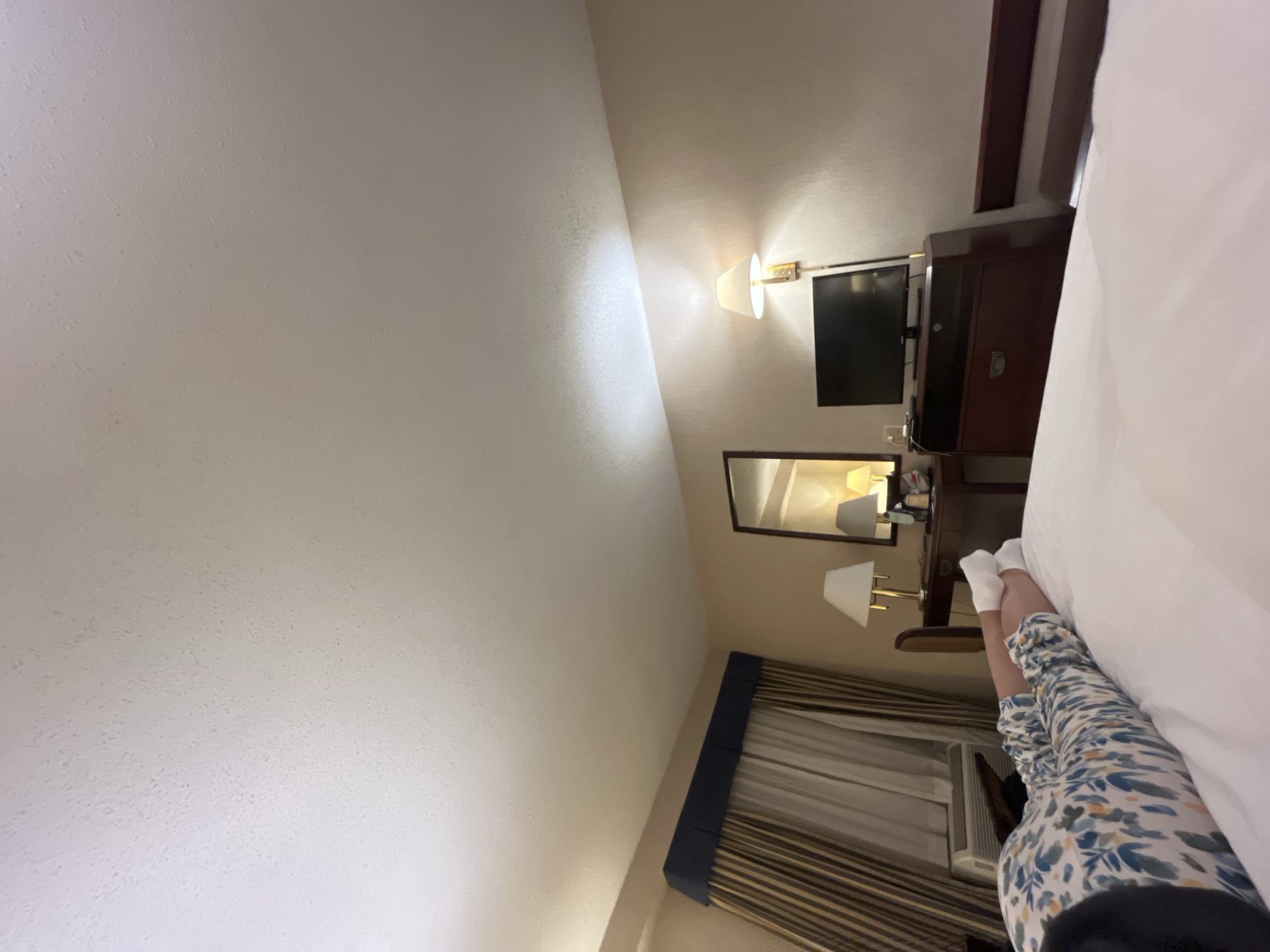 Person rests in bedroom during early morning hours