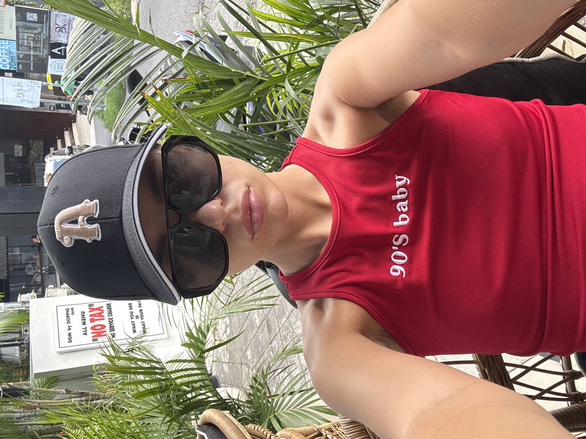 Person in 90s-themed clothing captured in selfie