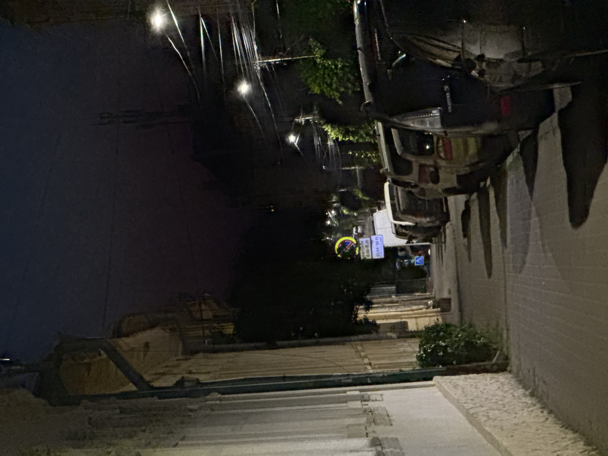 Full moon over parked cars on a quiet Chernivtsi street