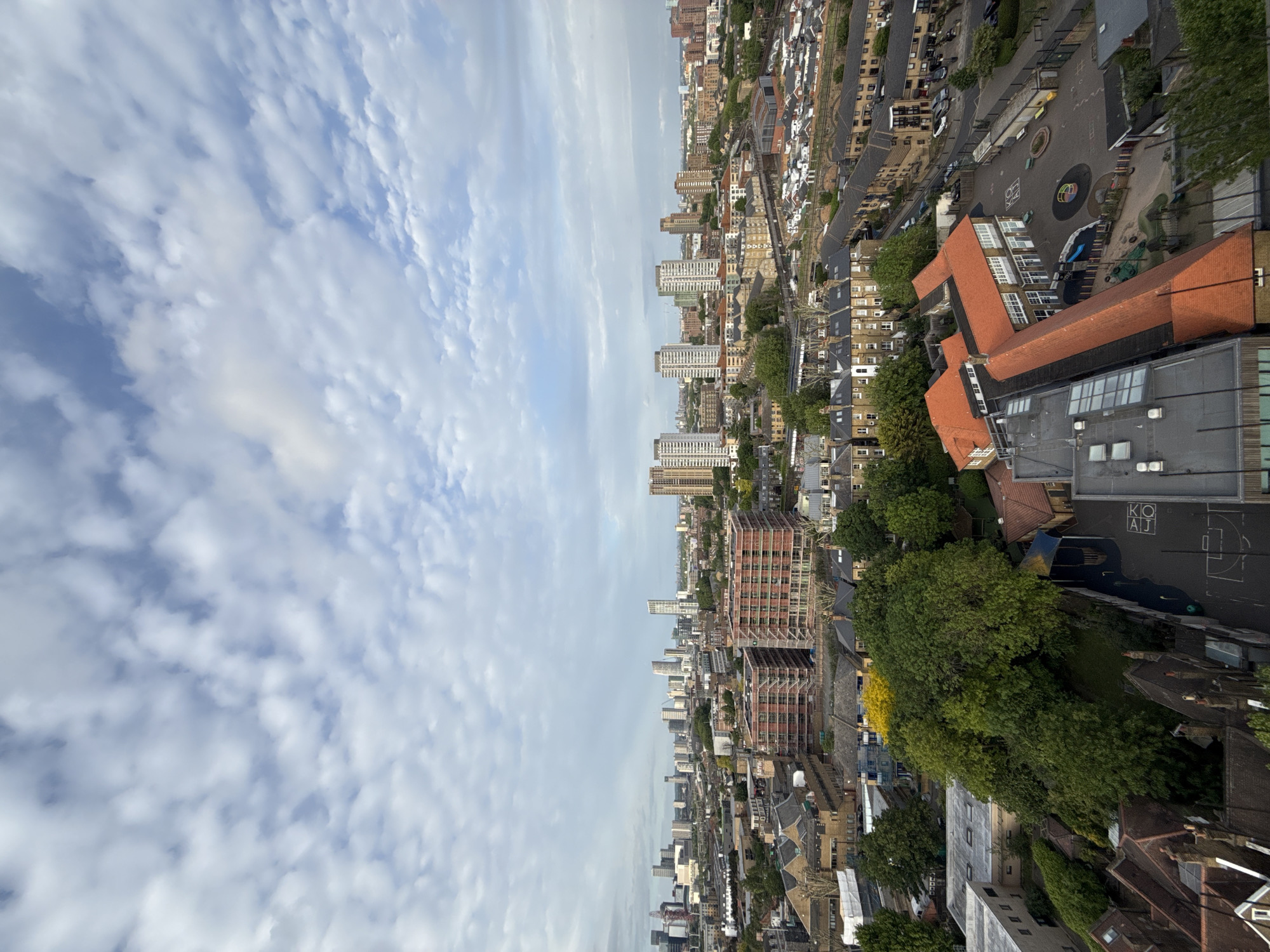 Aerial view captures London cityscape under cloudy skies