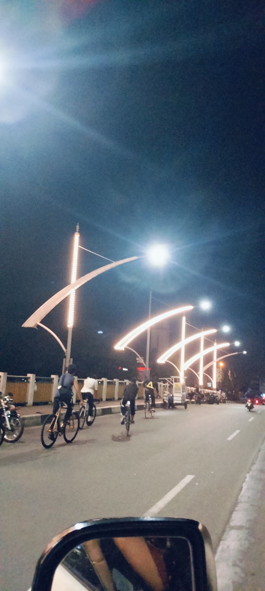 Evening life documented around illuminated mosques in Banda Aceh