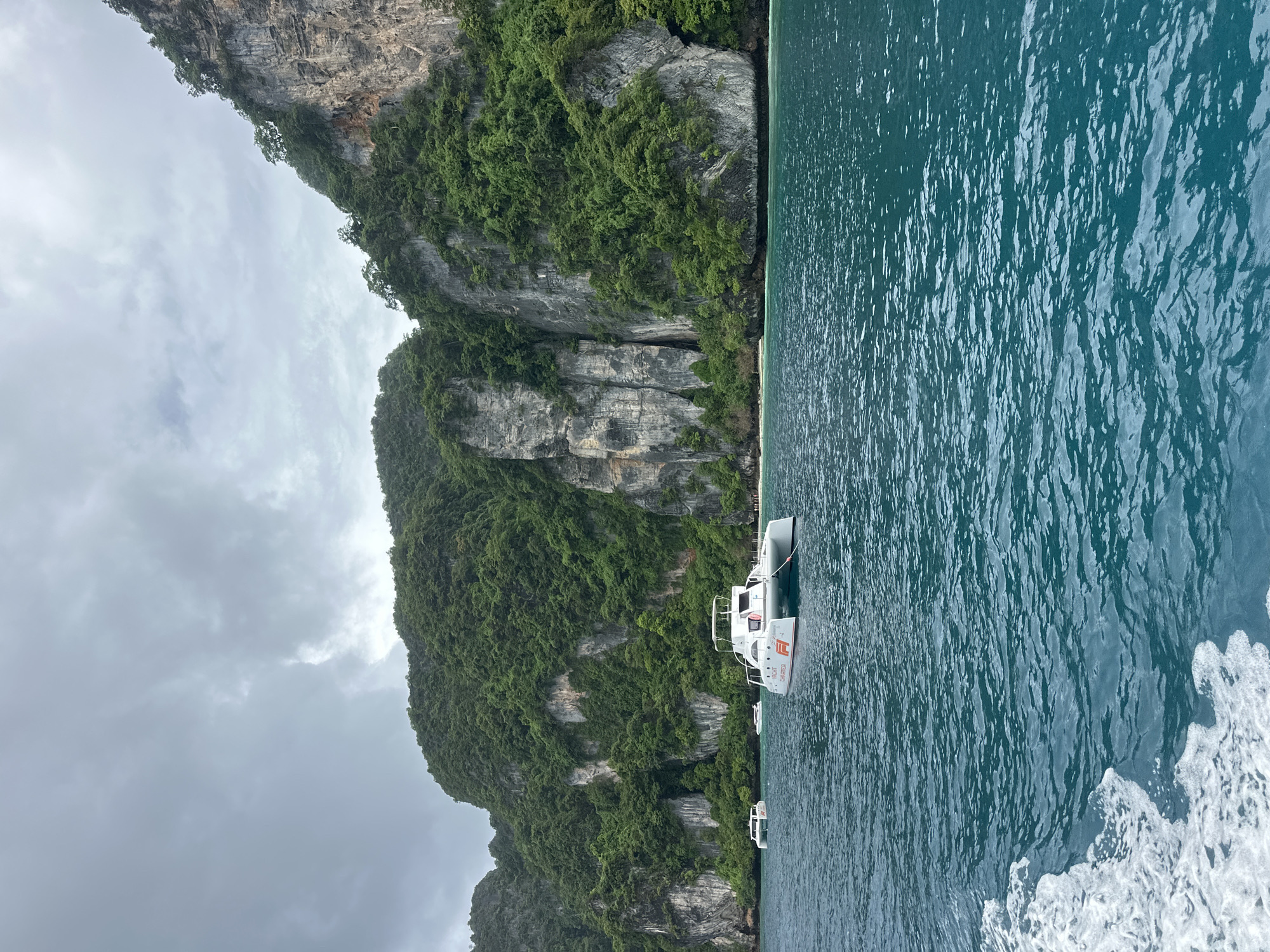 Charter catamaran anchored in Ao Nang's coastal waters