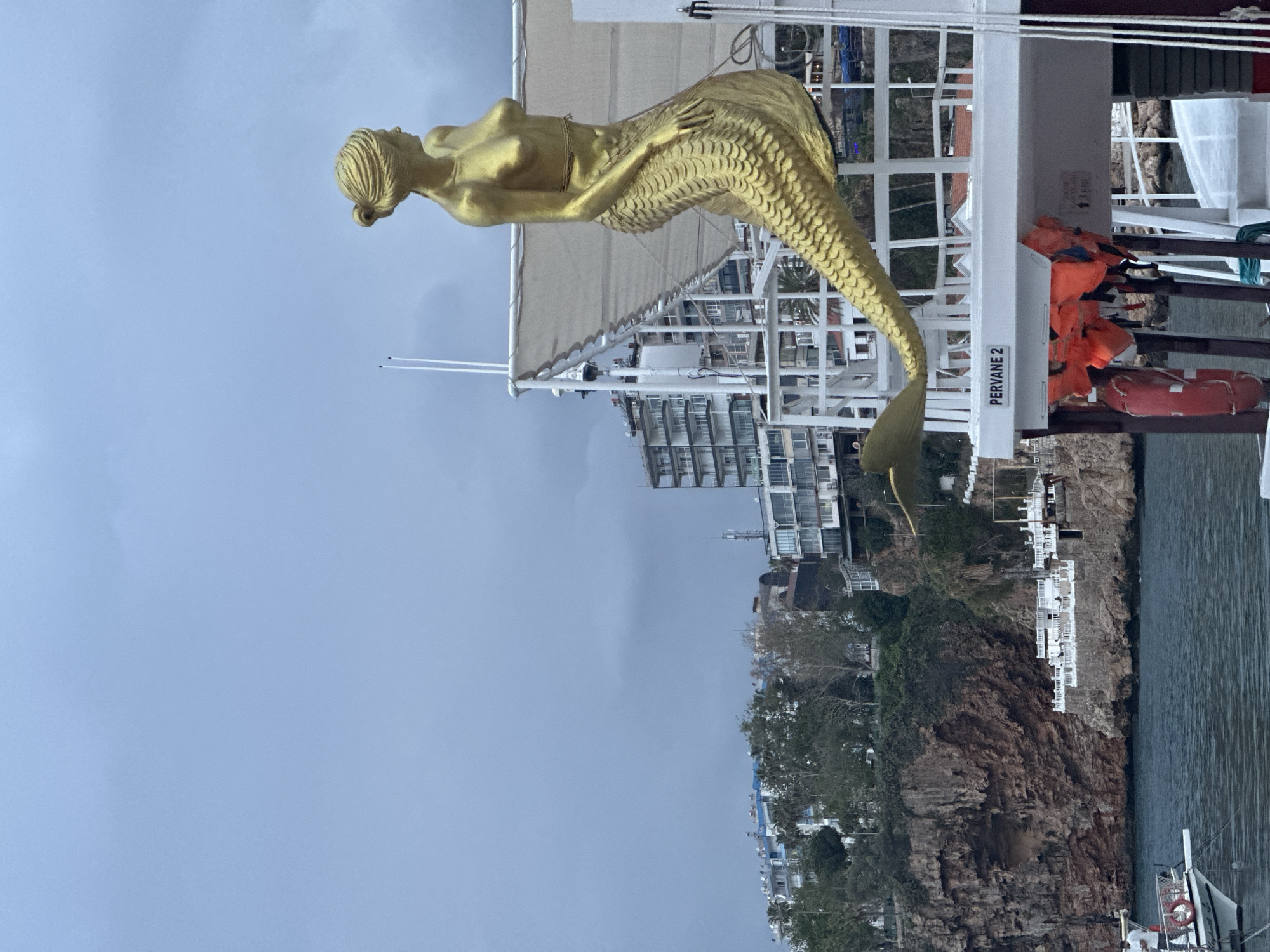 Golden mermaid statue spotted on white boat in Antalya