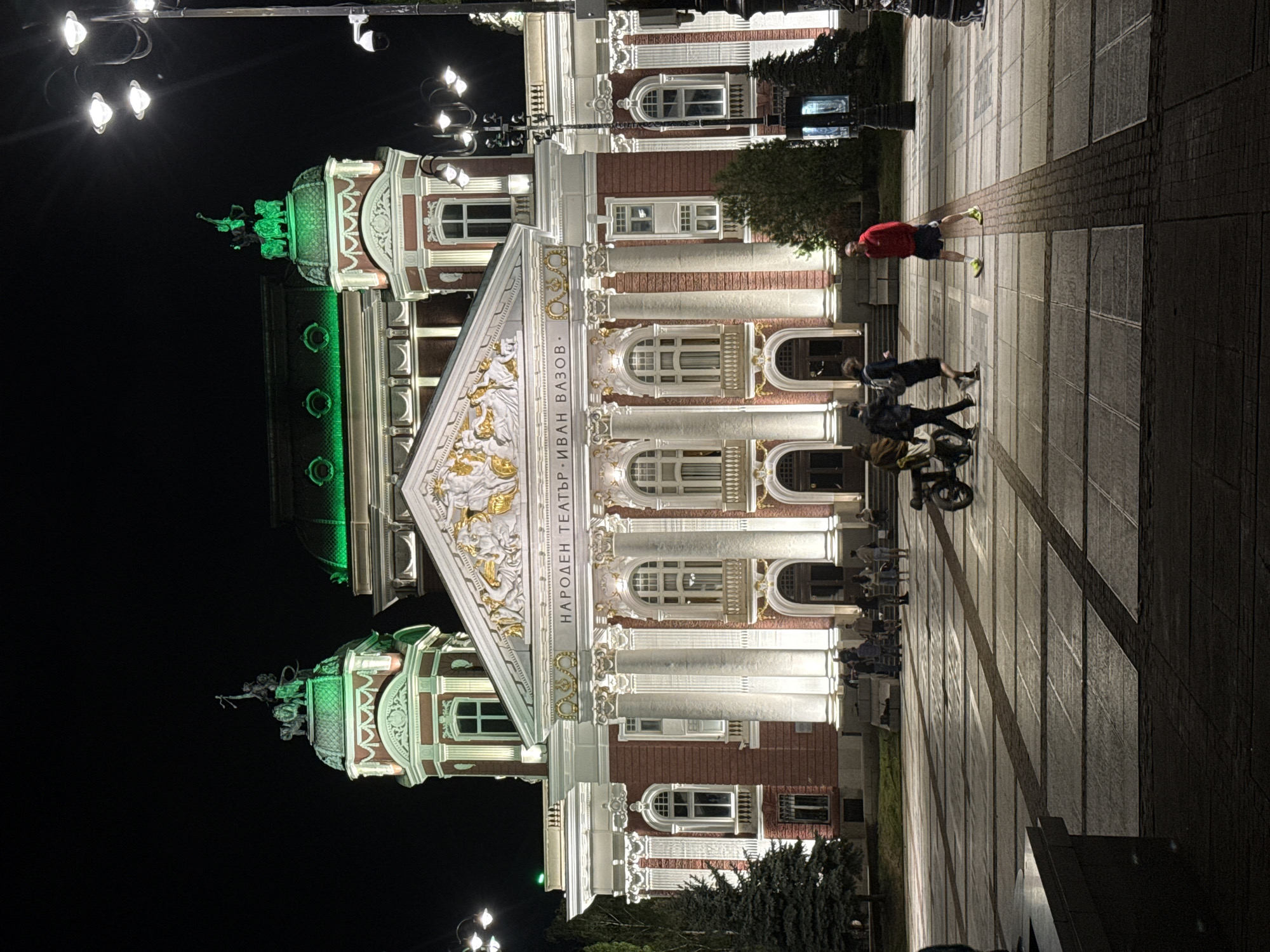 Sofia's National Theatre illuminated in white and green lights