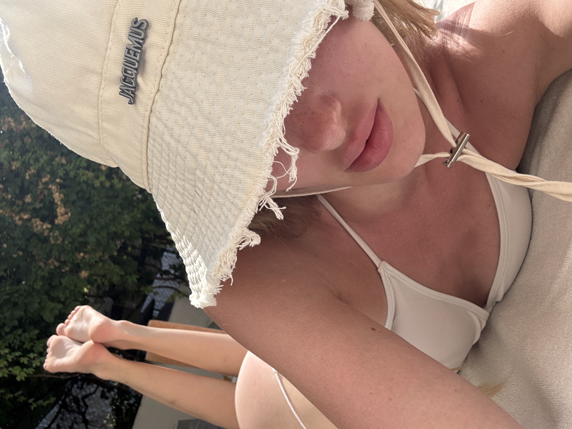 Lounging in Kemer with a Jacquemus hat, white bikini