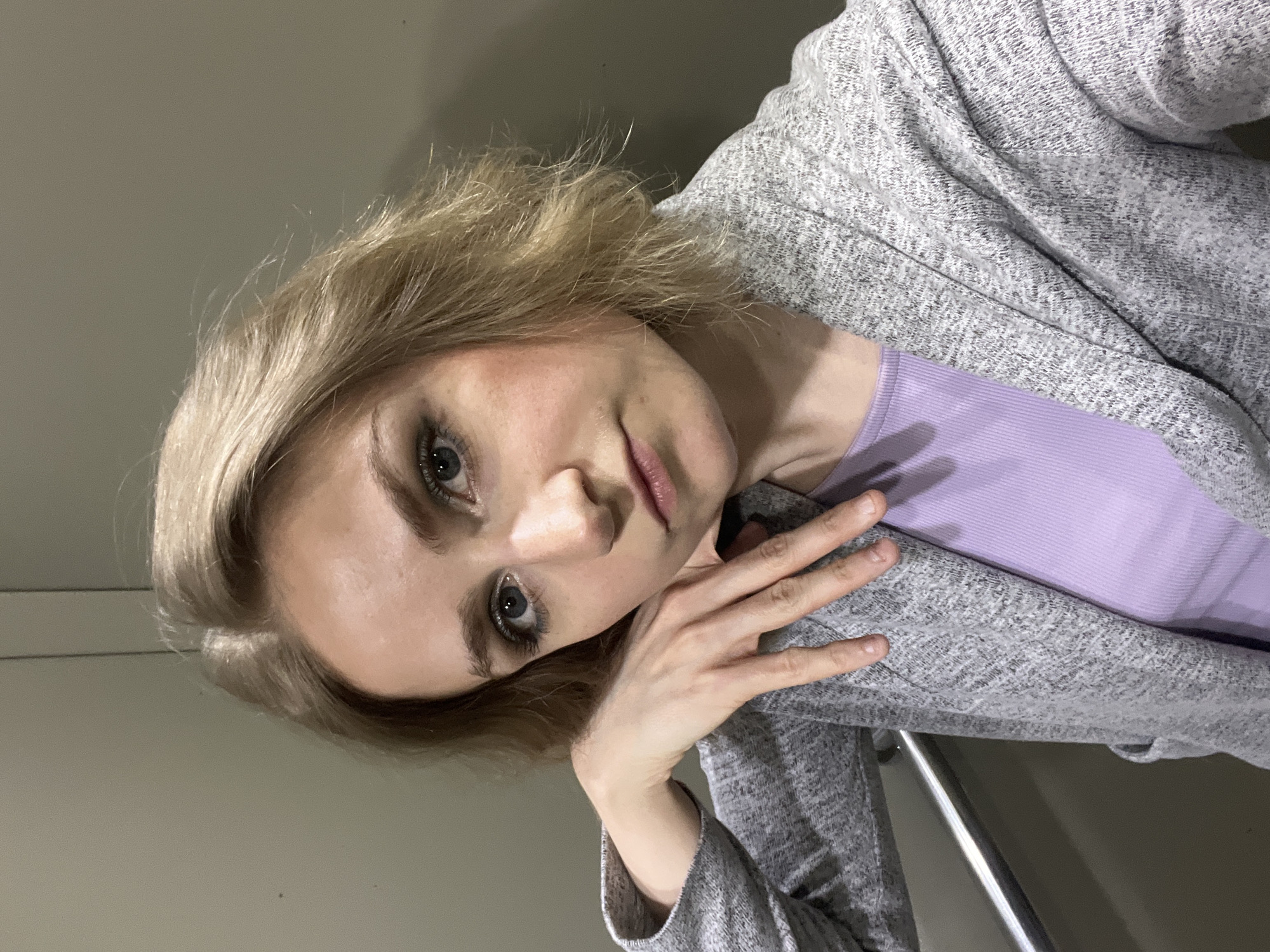 Woman photographed in casual morning setting in Novosibirsk apartment