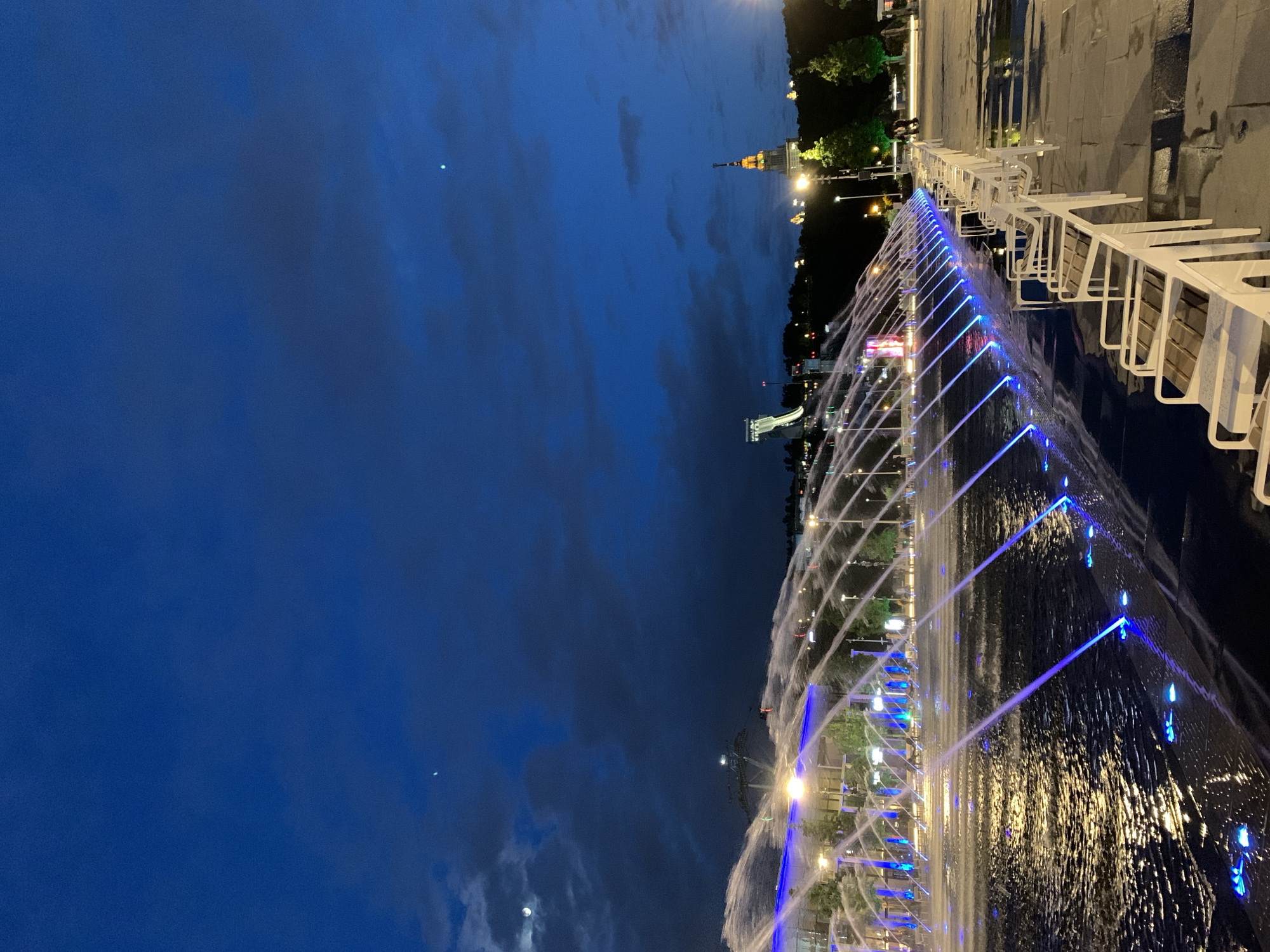 Moscow landmarks glow blue during evening hours across city