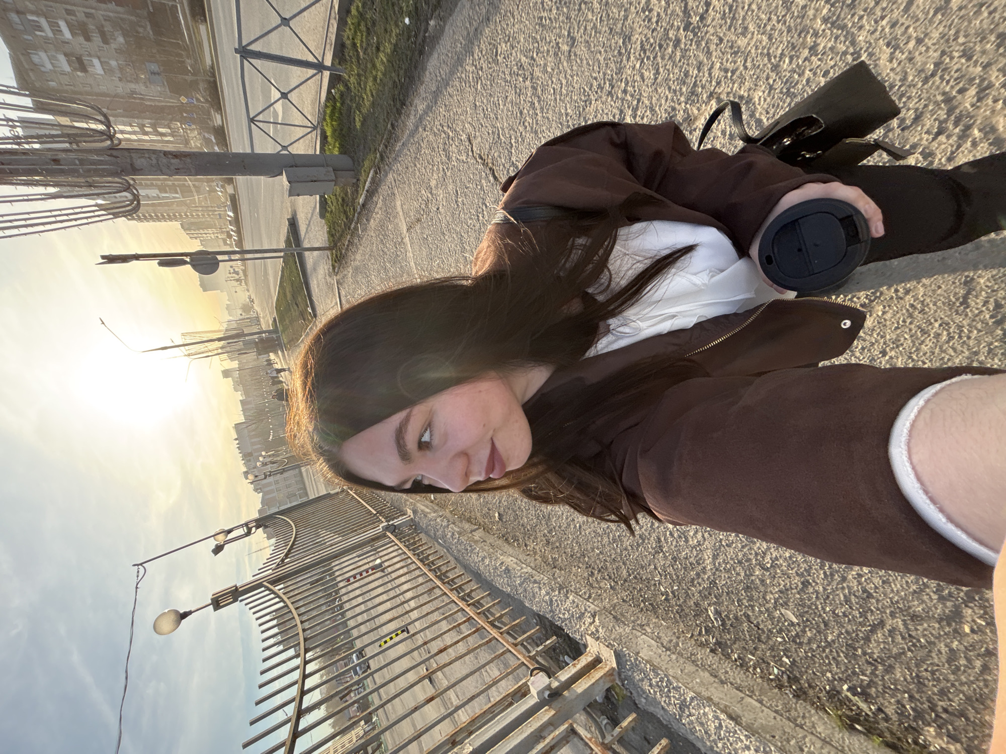 Woman takes sunset selfie on Perm street