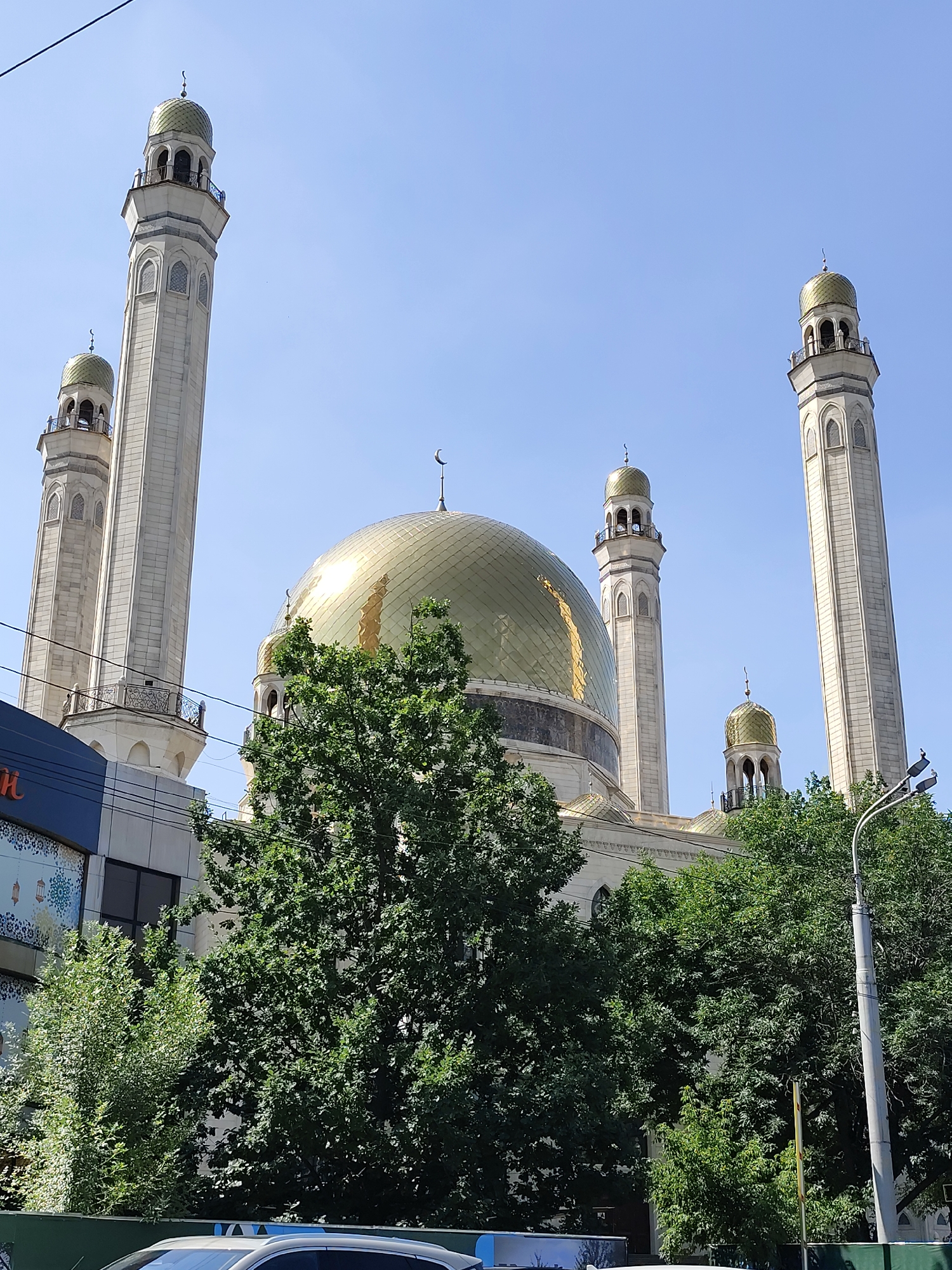 Golden-domed mosque rises under clear skies in Almaty