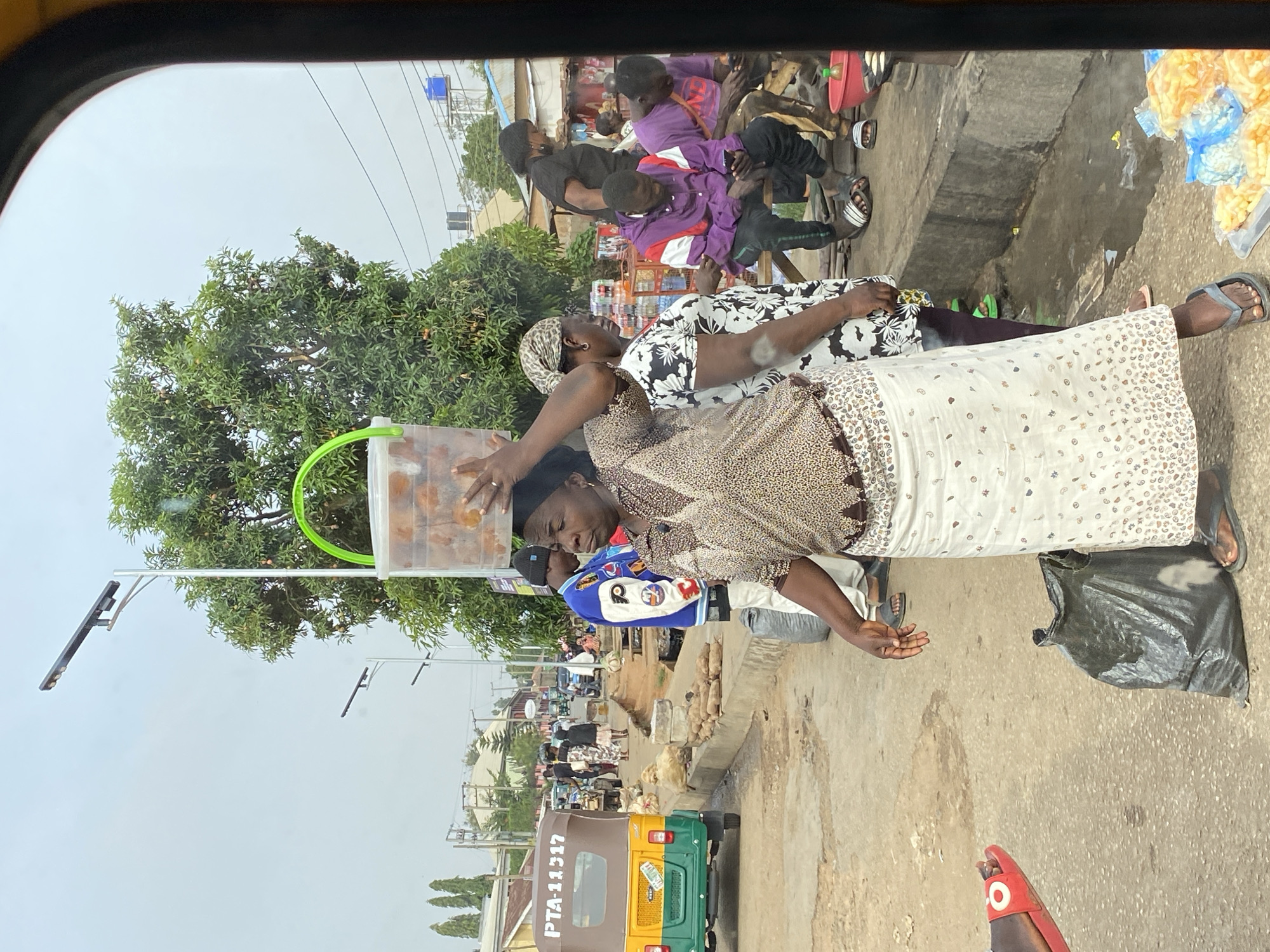 Street vendors conduct morning business in Bukuru, Nigeria
