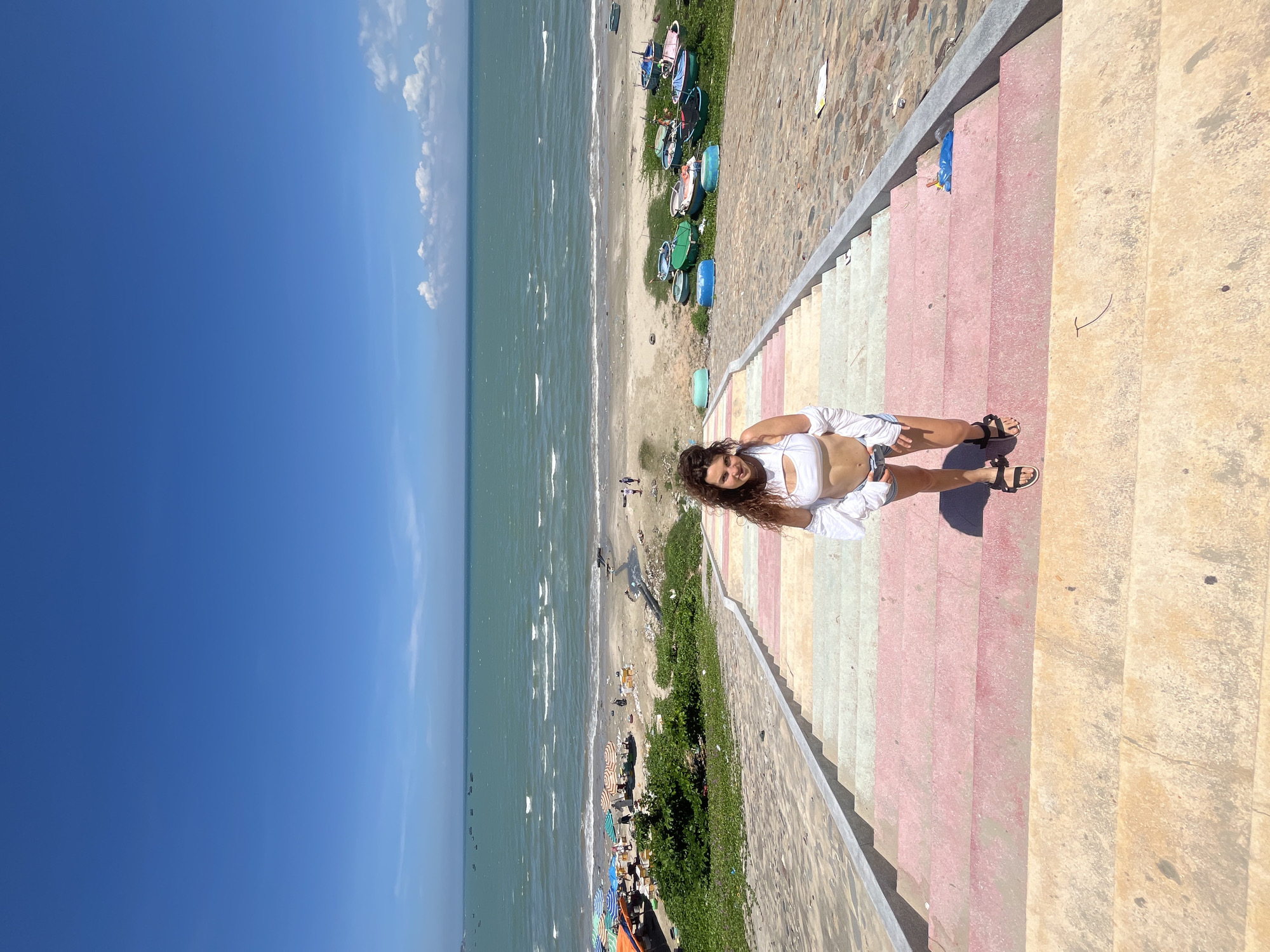 Posing along Mũi Né's colorful beachfront staircase and walkway
