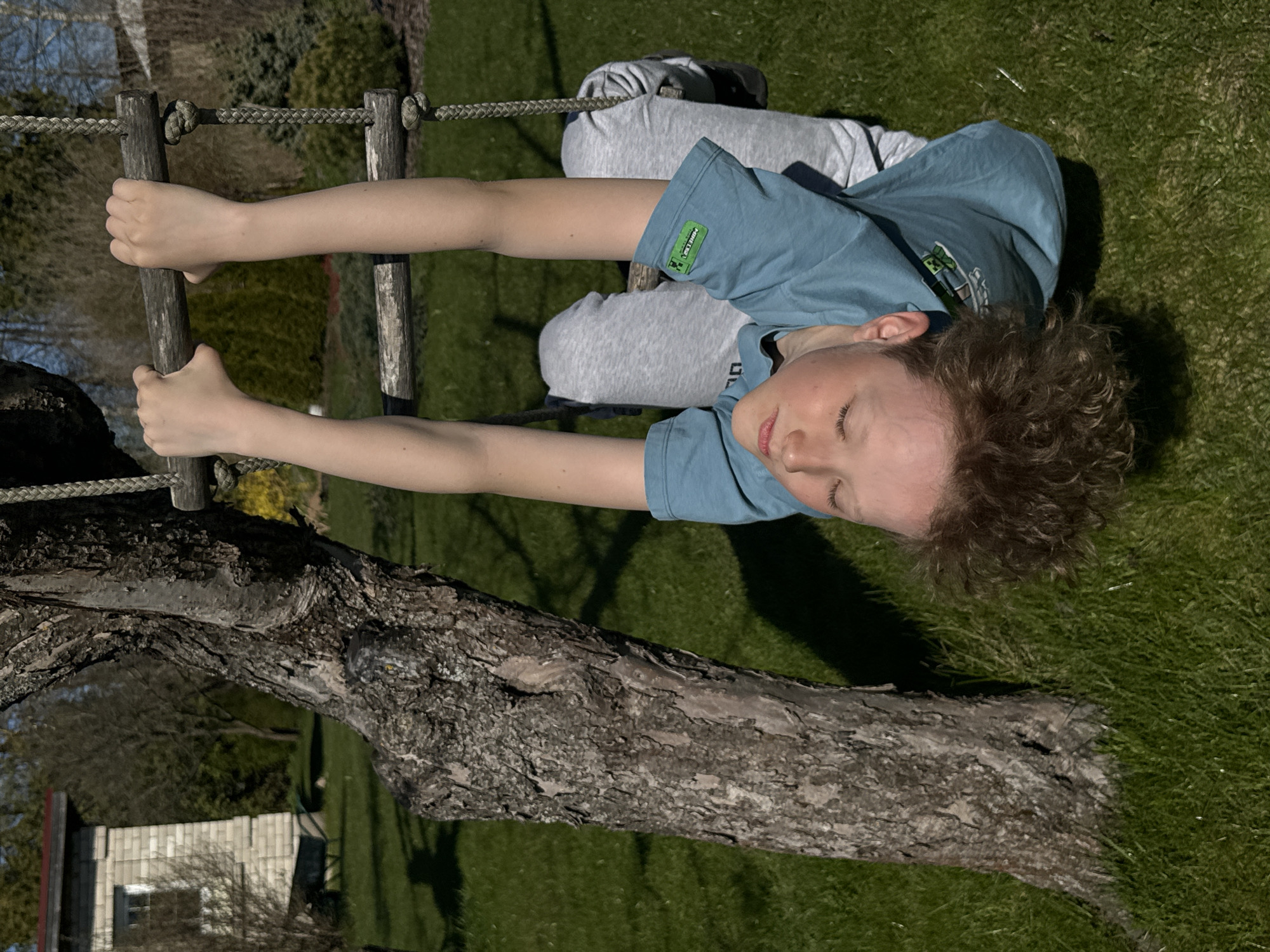 Children play outdoors in sunny Carnikava backyard