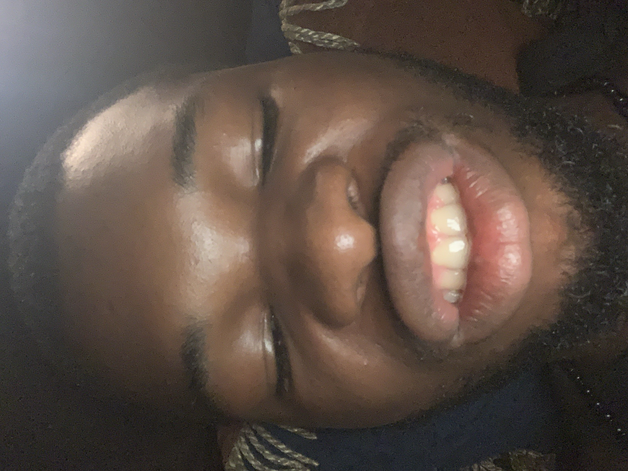 Close-up portraits captured in Onitsha show expressive facial poses