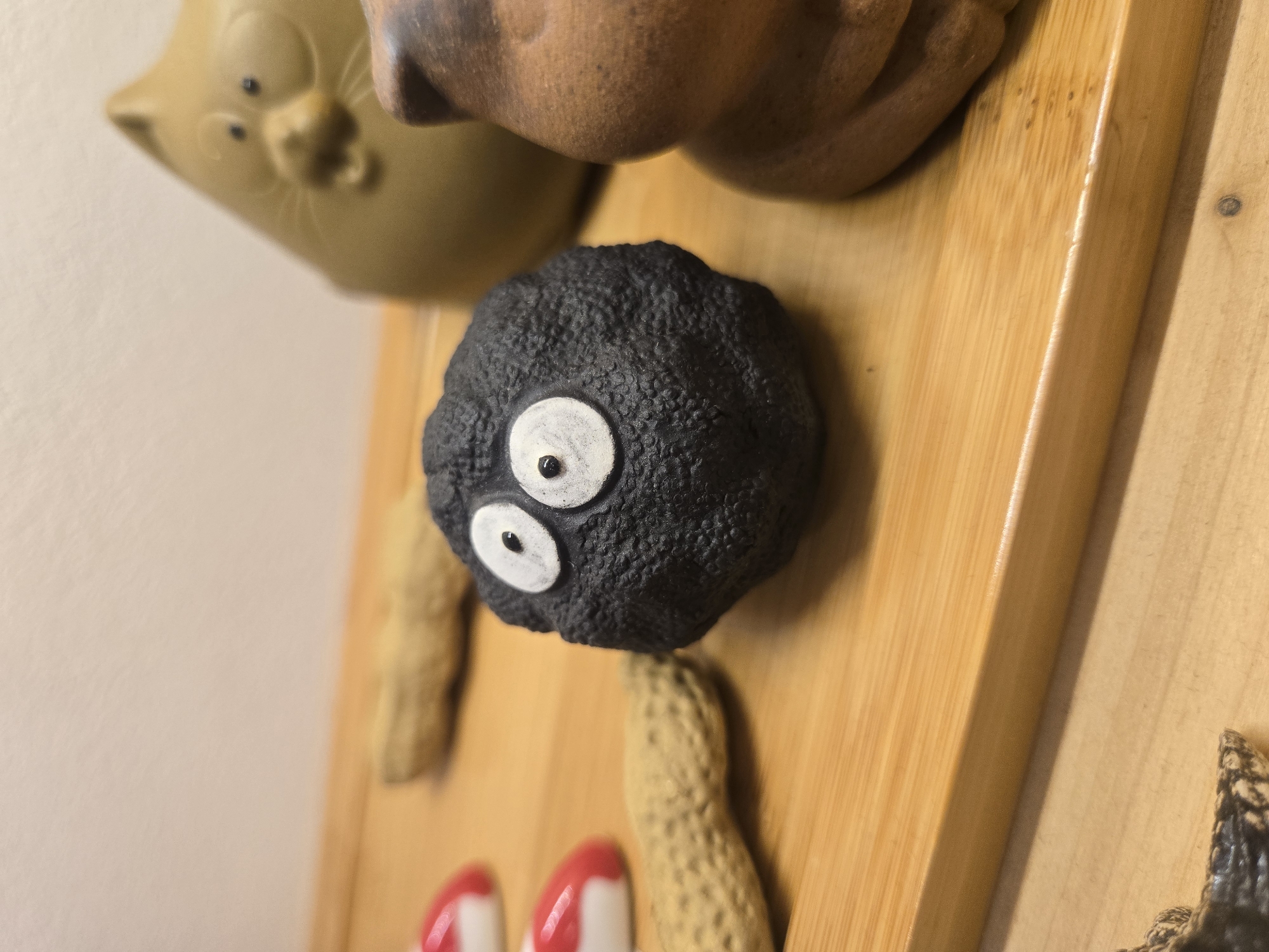 Ceramic figurine collection and tattooed hands documented in Budva