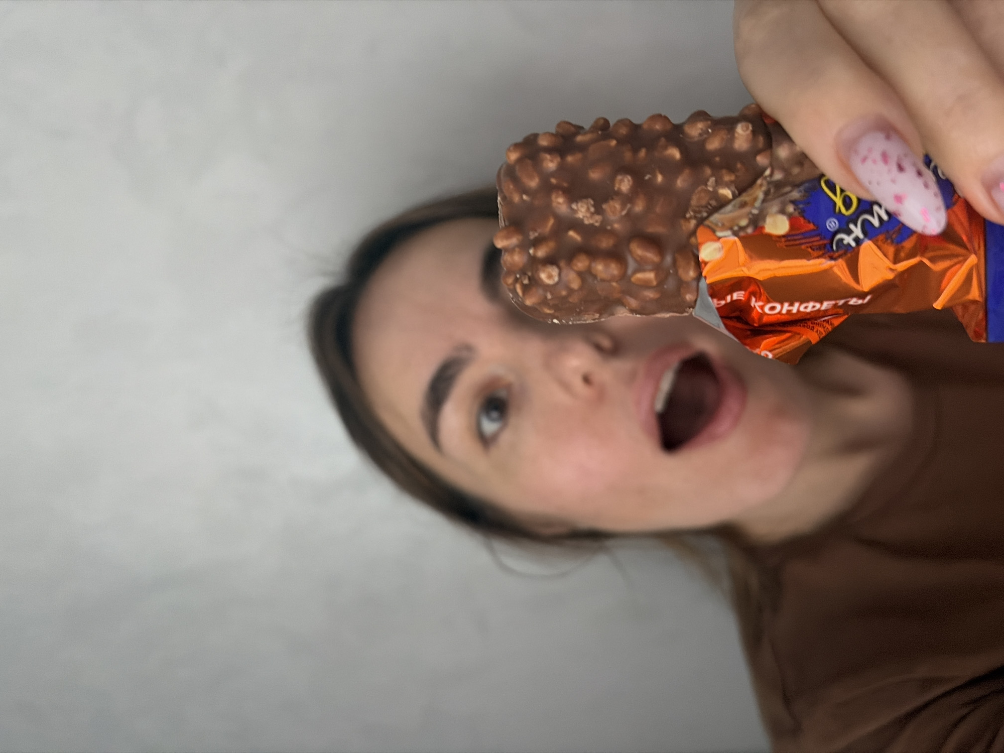 Woman holds chocolate bar in Neftekamsk, Russia