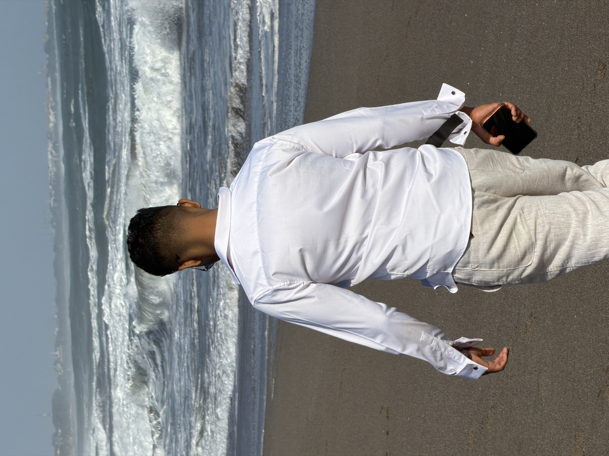 Morning beach activity on North Kuta's dark sand shore