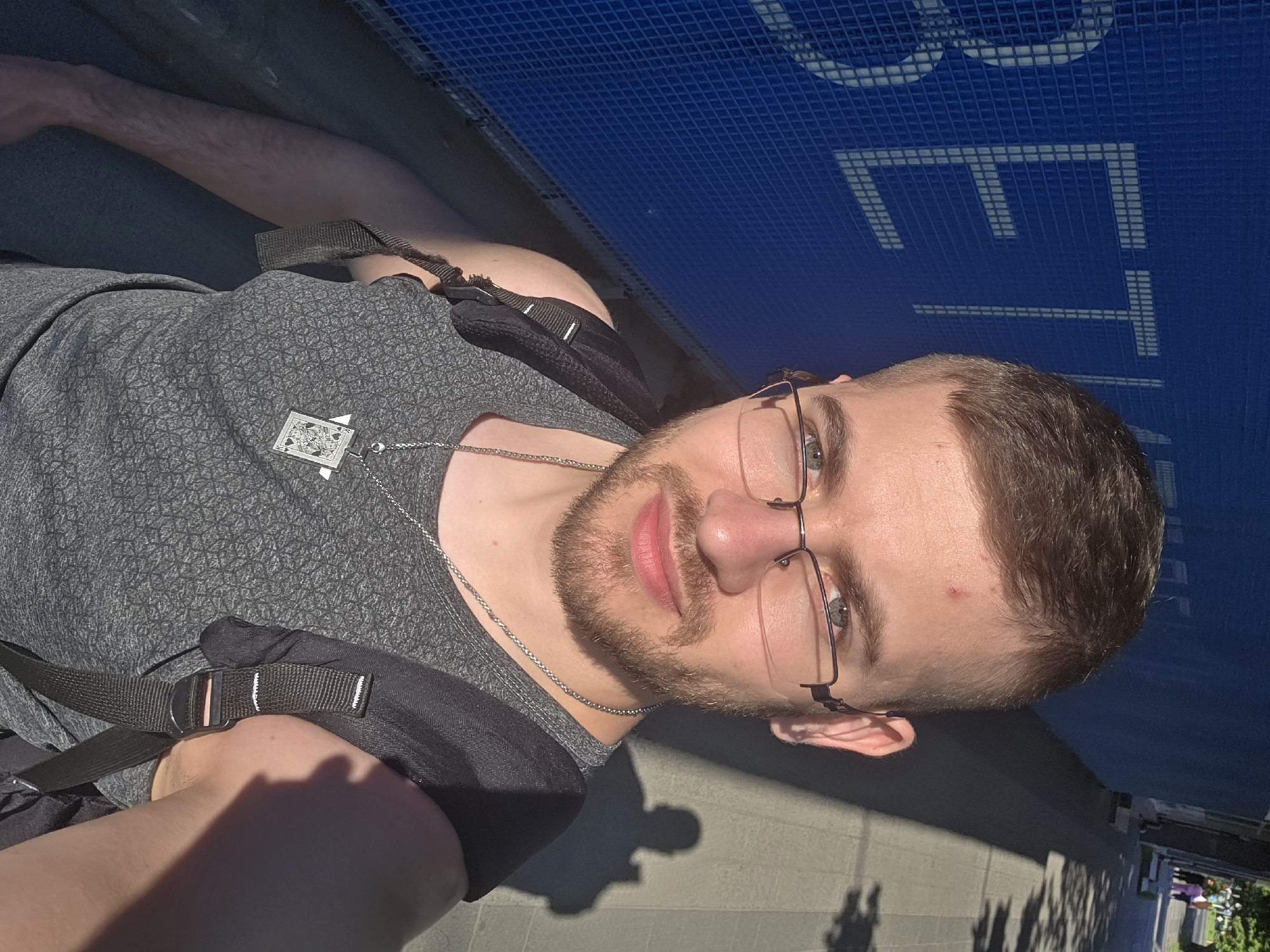 Tourist takes selfie on Plovdiv walkway amid street scene