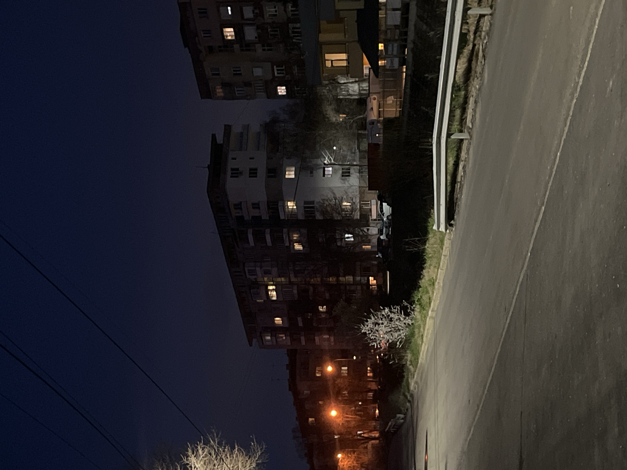Evening lights illuminate apartment building in Pernik, Bulgaria