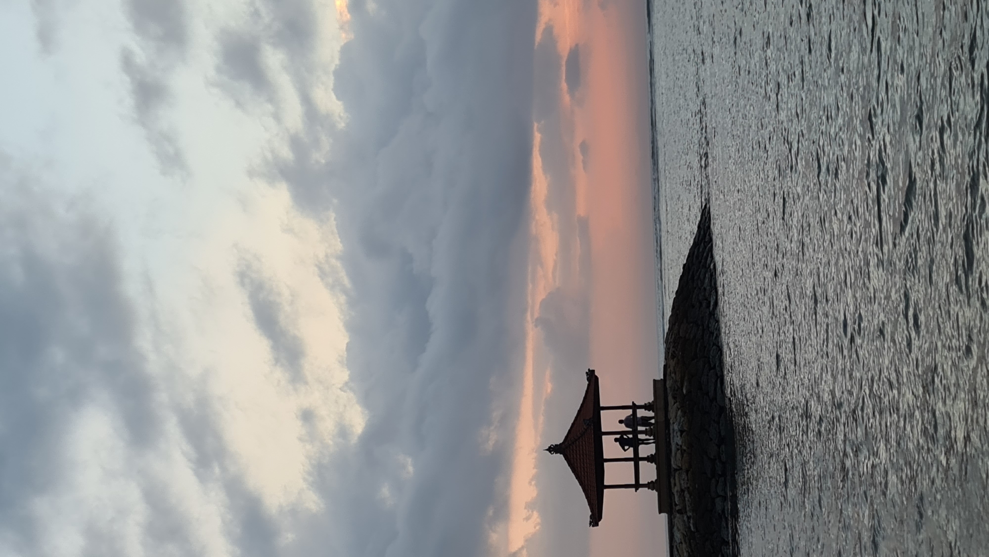 Dusk at Sanur Beach, Balinese gazebo on the water