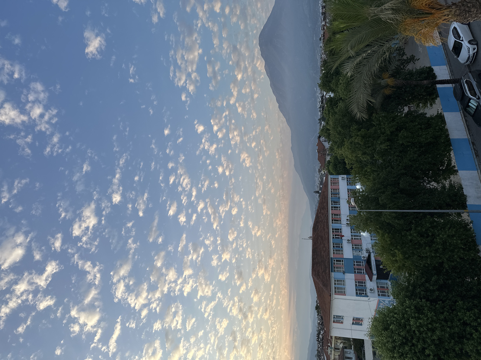 Sunrise over Fethiye, school building and city in morning light