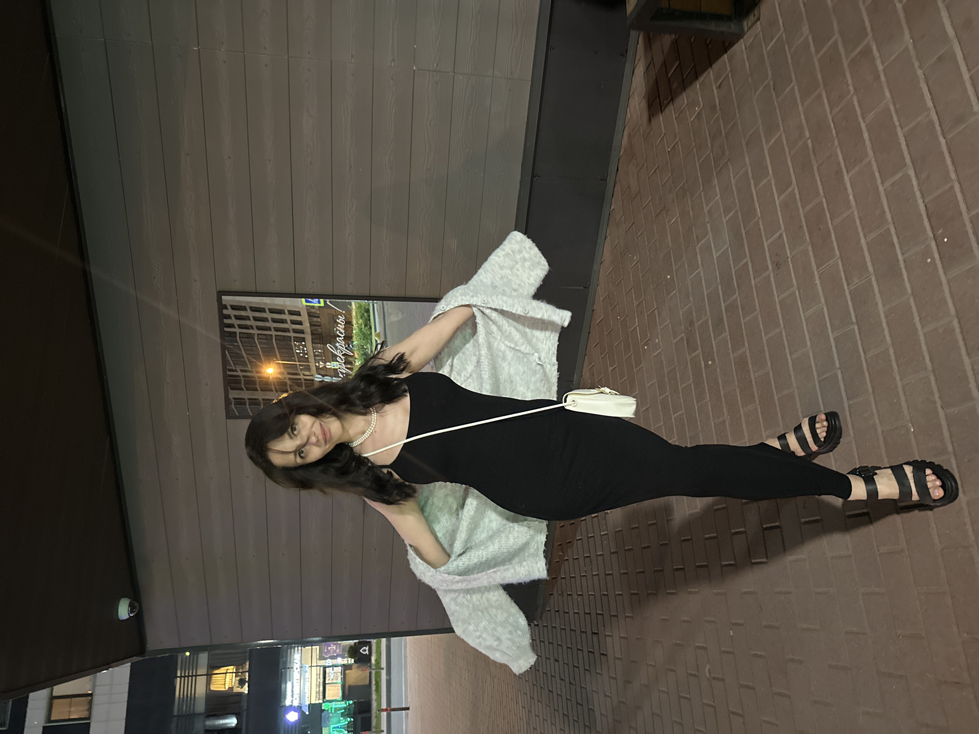 Woman poses for nighttime urban photo session