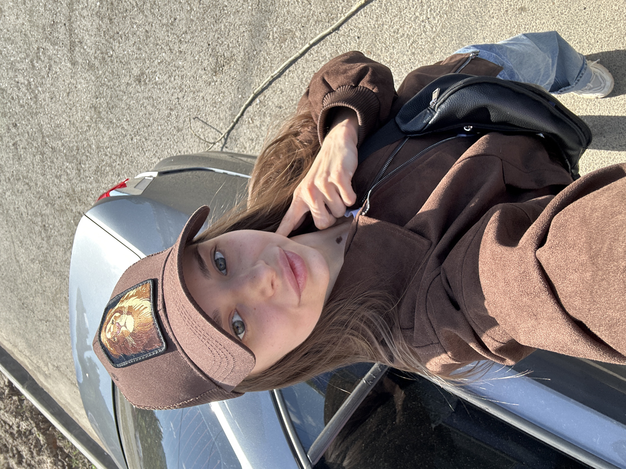 Woman photographed in brown outfit at two Izhevsk locations