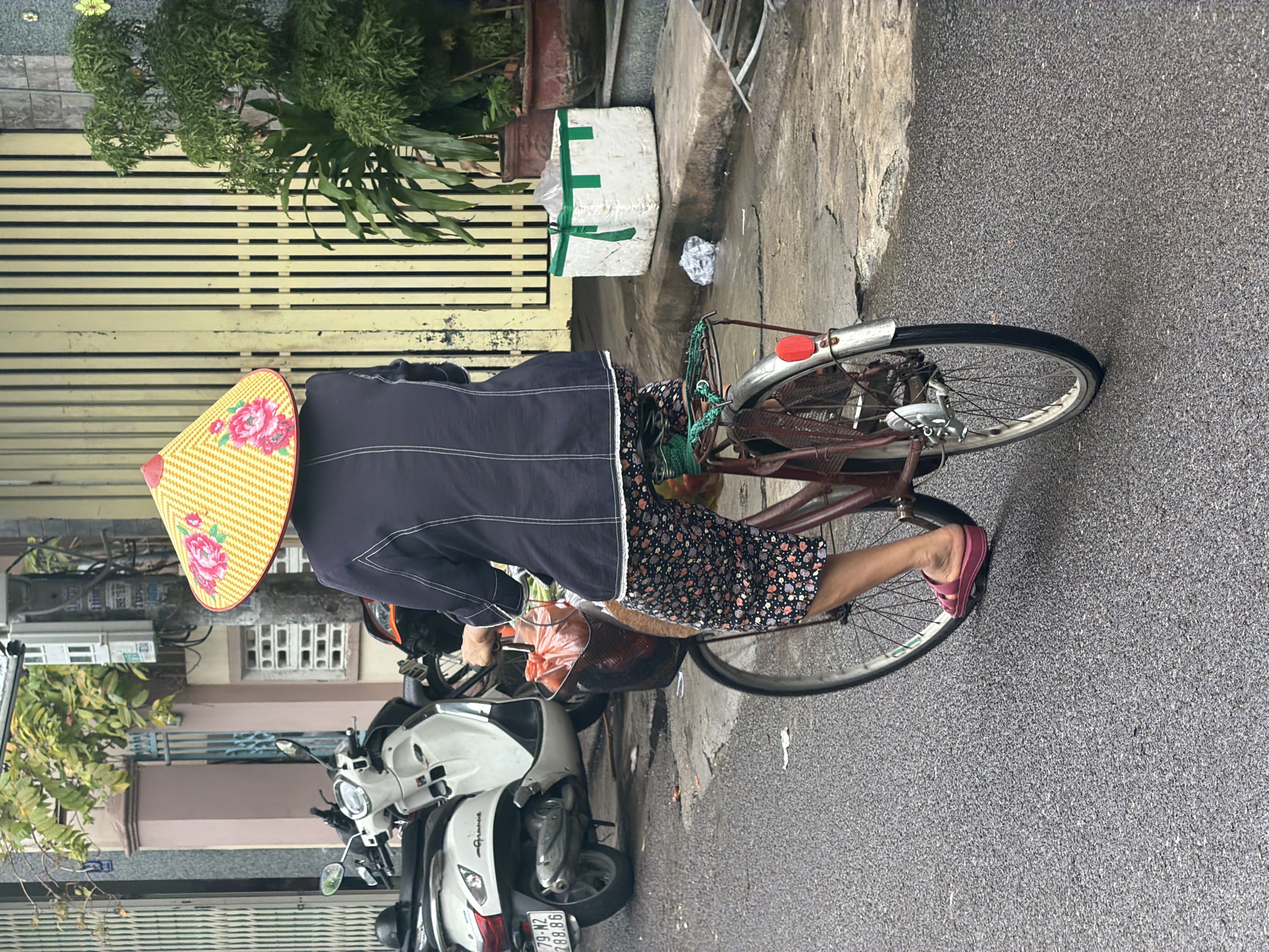 Cyclist in traditional dress spotted on Nha Trang streets
