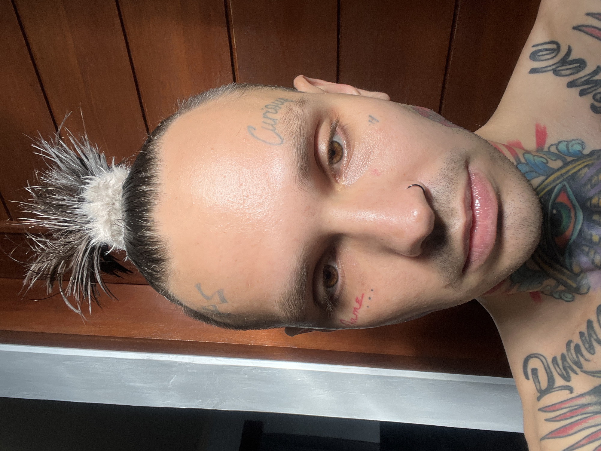 Close-up portraits showcasing extensive face and neck tattoos